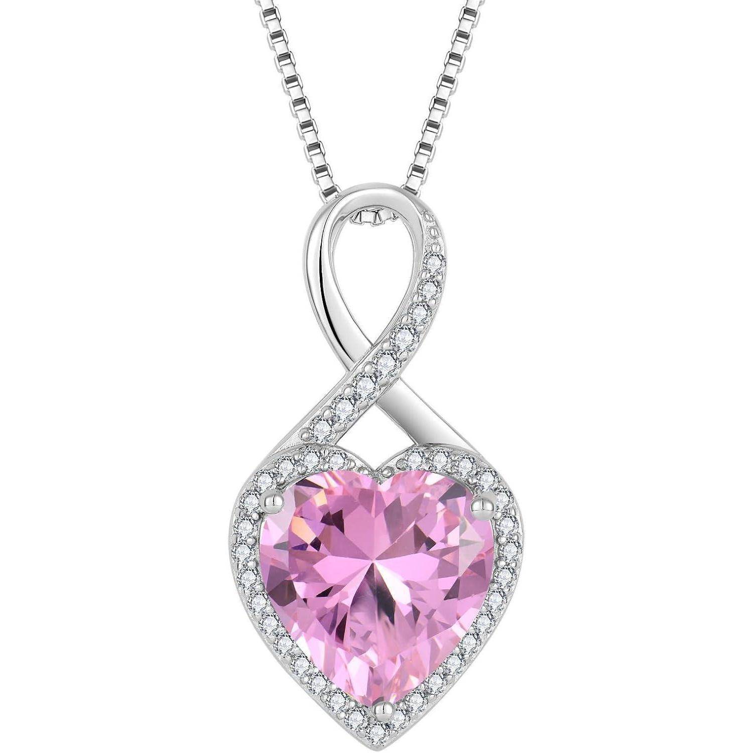 Silberne Anhängerkette mit einer Endlosschleife über einem herzförmigen rosa Edelstein, umgeben von kleinen klaren Steinen.