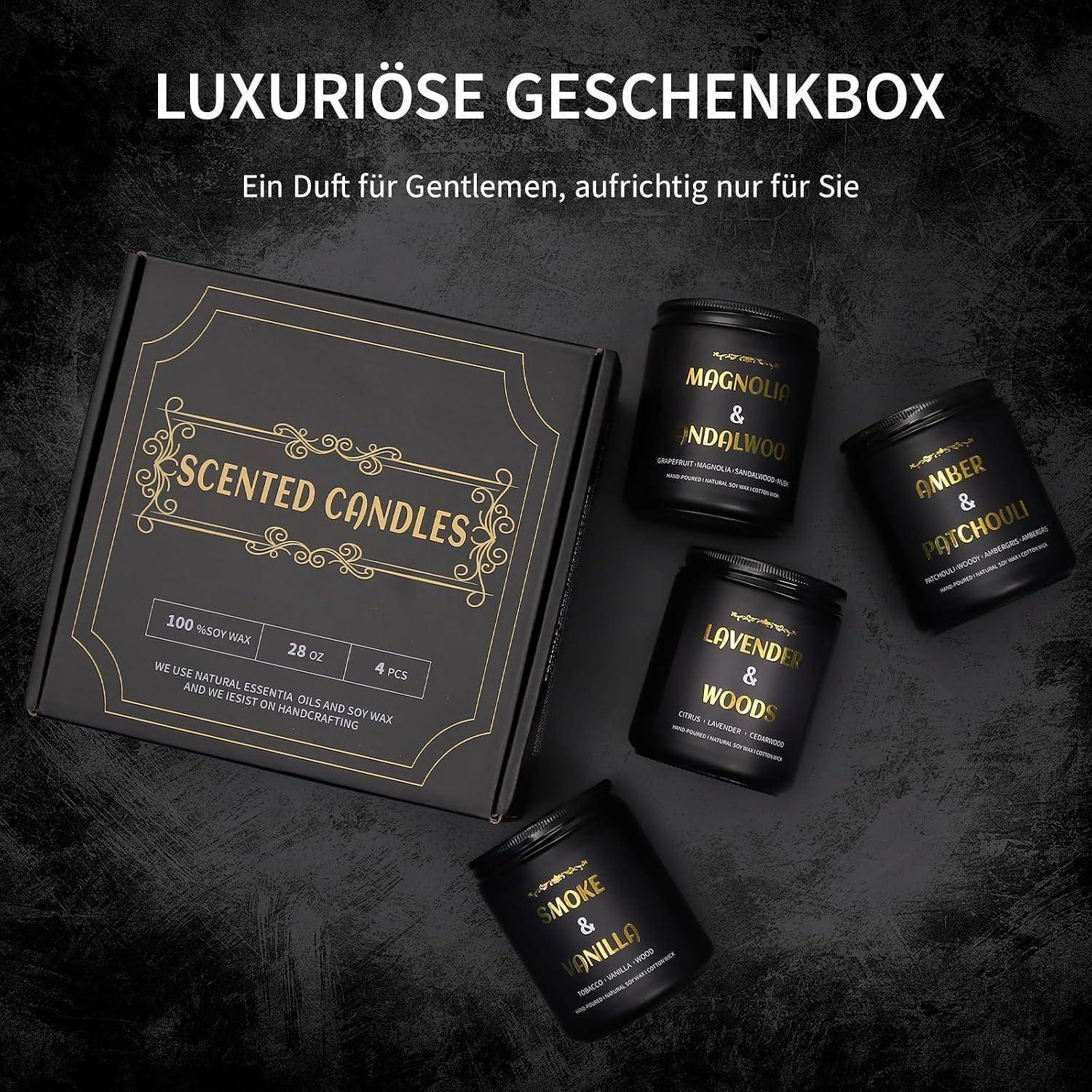 Luxus-Geschenkbox mit duftenden Kerzen und vier schwarzen Gläsern mit den Aufschriften Magnolie & Sandelholz, Bernstein & Patschuli, Lavendel & Hölzer und Rauch & Vanille.