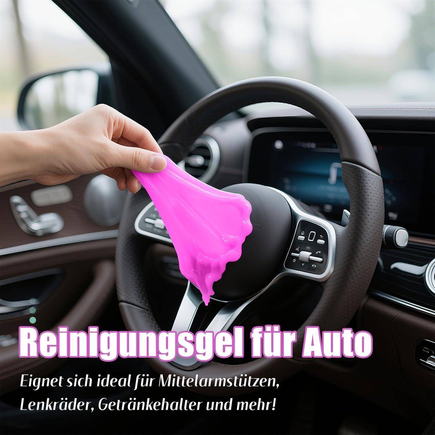 Hand hält rosafarbenes Reinigungsgel in einem Auto, gezeigt über dem Lenkrad mit deutschem Text: 'Reinigungsgel für Auto' und 'Eignet sich ideal für Mittelarmstützen, Lenkräder, Getränkehalter und mehr!