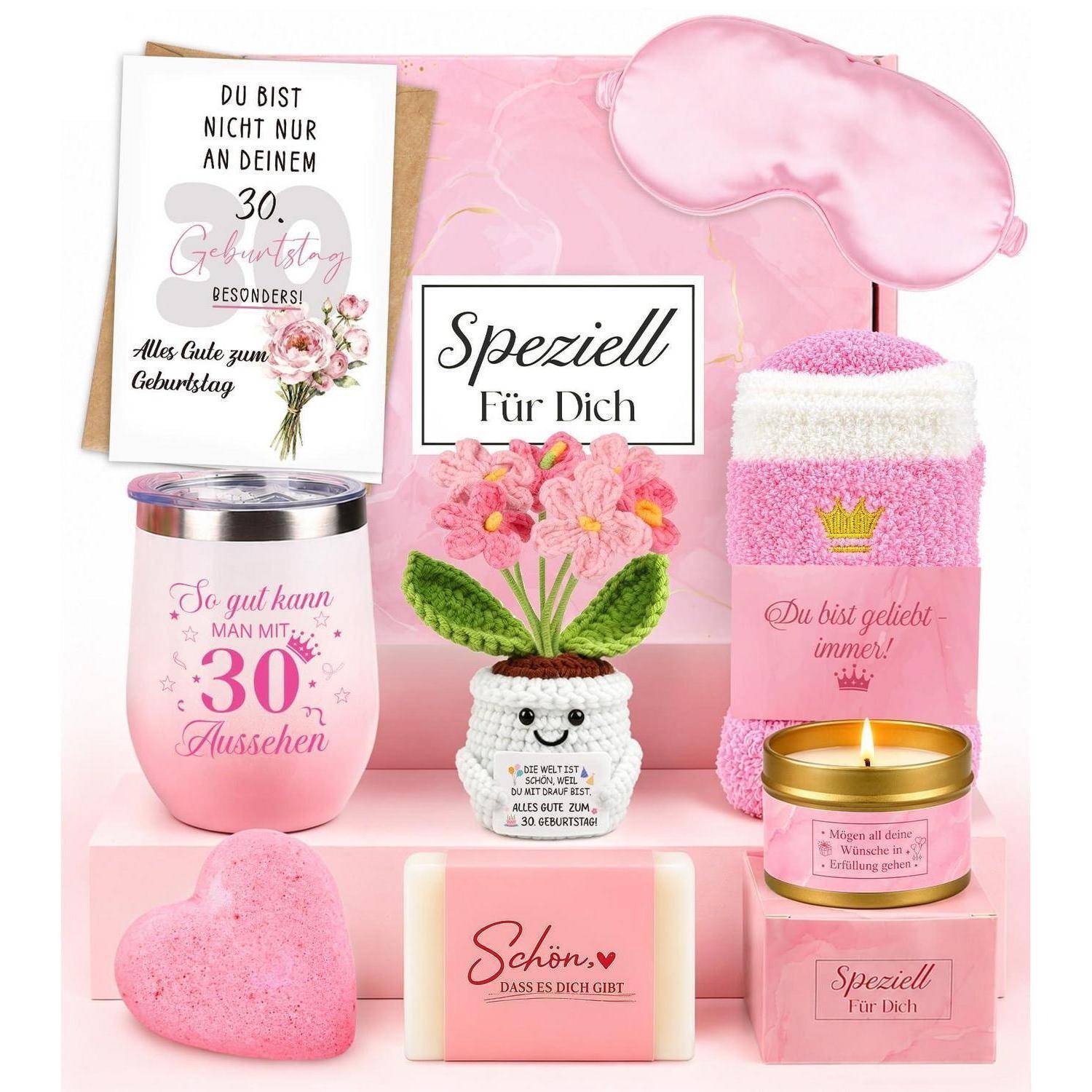 Rosafarbenes Geburtstagsgeschenkarrangement mit Karte, Blumentopf, Kerze, Becher, Schlafmaske, Seife und herzförmiger Badebombe; zentrales Schild liest „Speziell Für Dich
