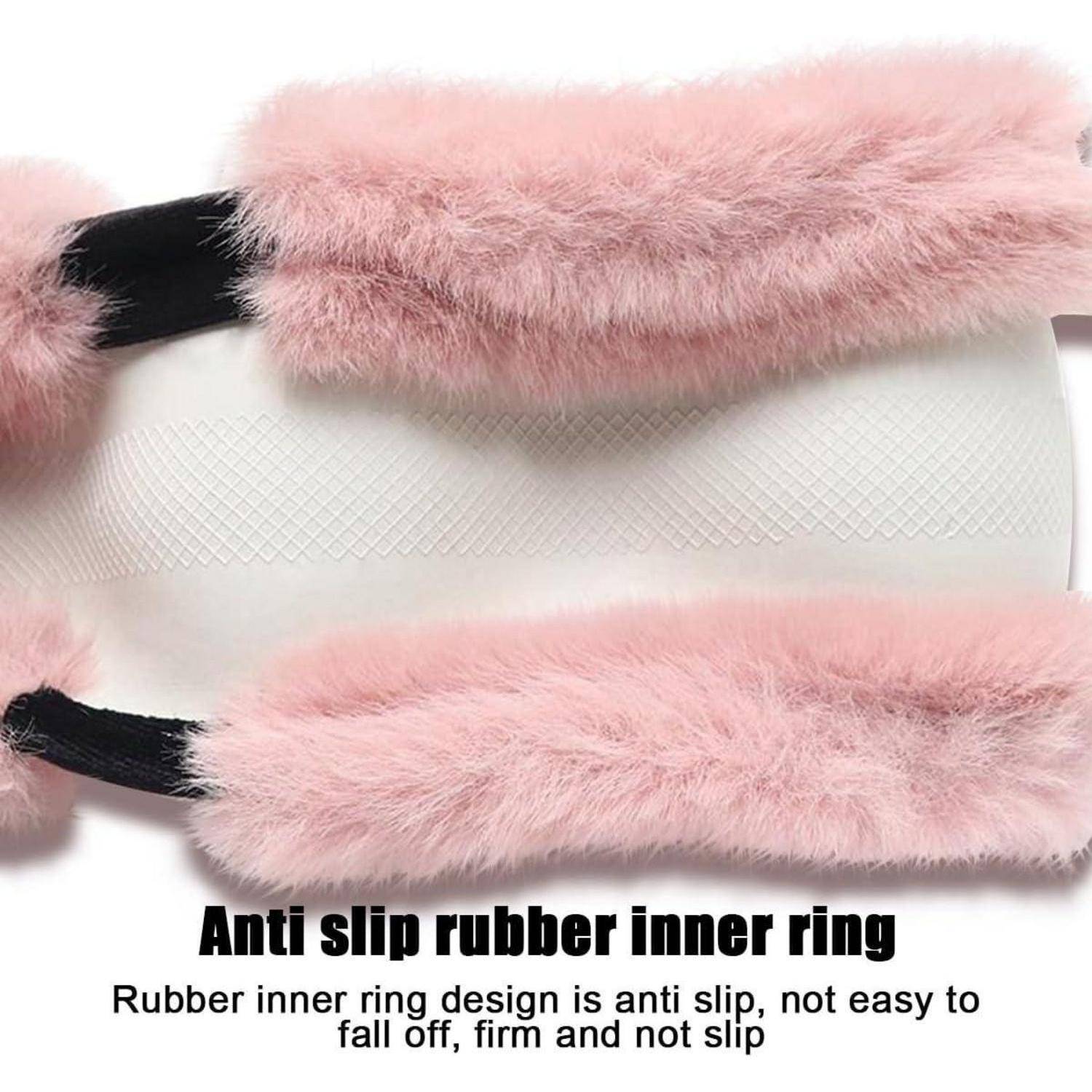 Rosa flauschige Handgriffe mit einem weißen strukturierten Gummiinnenring und dem Text „Anti-Rutsch-Gummiinnenring" mit Anti-Rutsch-Design