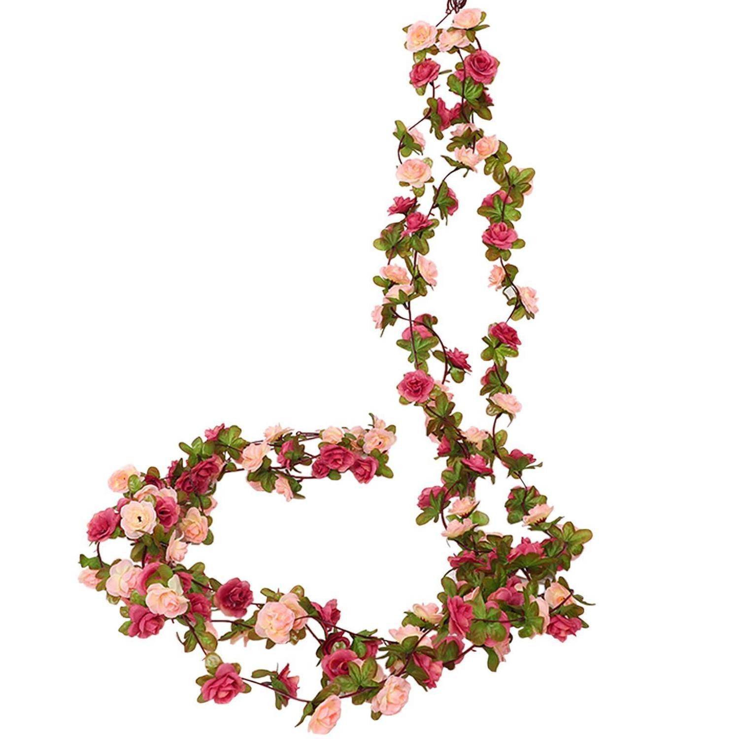 Rosa und rote Blumengirlande, die in einer großen stilisierten Ornament- oder Buchstabenform auf weißem Hintergrund angeordnet ist.