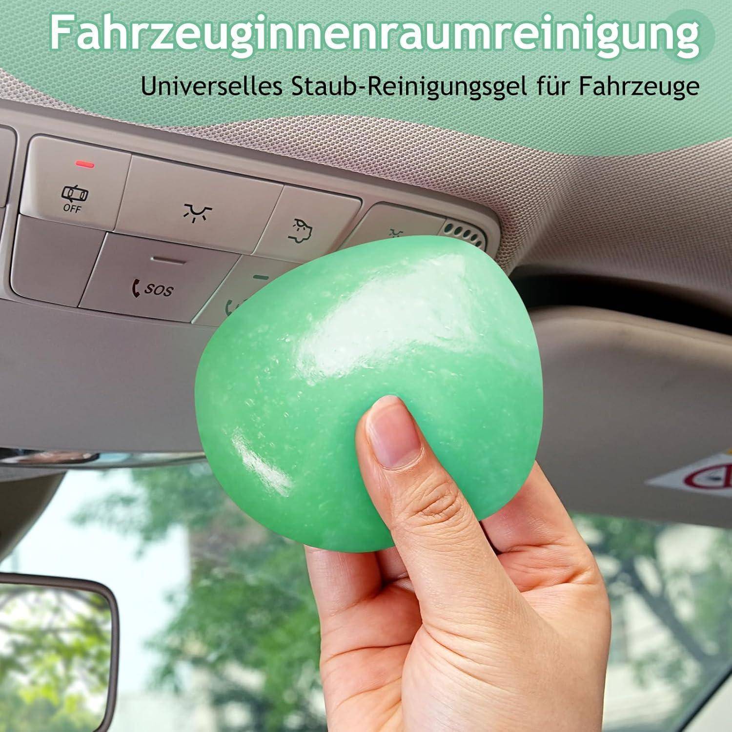 Hand drückt grünes Reinigungsgel auf ein Armaturenbrett im Autoinnenraum, mit deutschem Text, der universelles Staubentfernungsgel für Fahrzeuge bewirbt.
