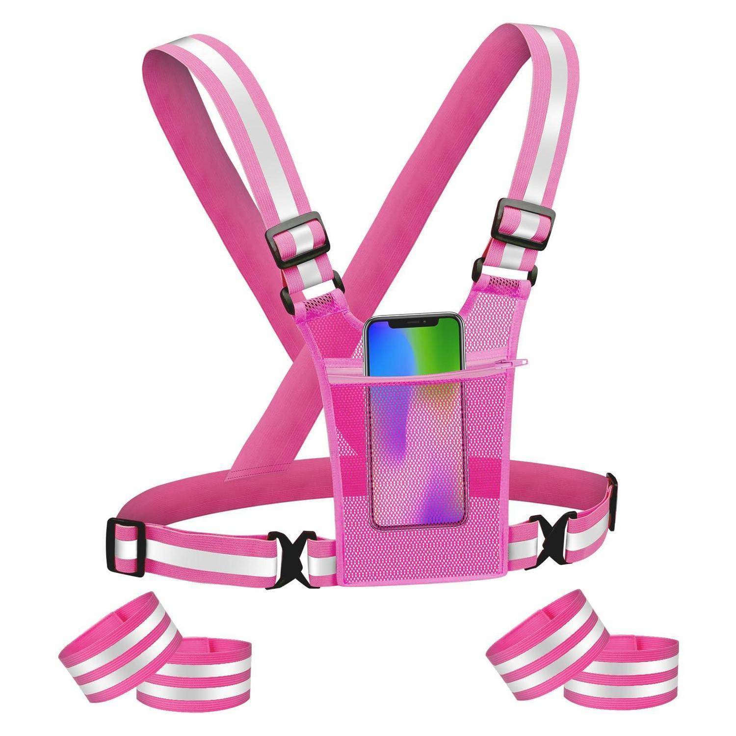 Pinkgibt es ein reflektierendes Lauf-Tragegestell mit Handytasche und verstellbaren Riemen, gezeigt mit zwei passenden Fußgelenkbändern.