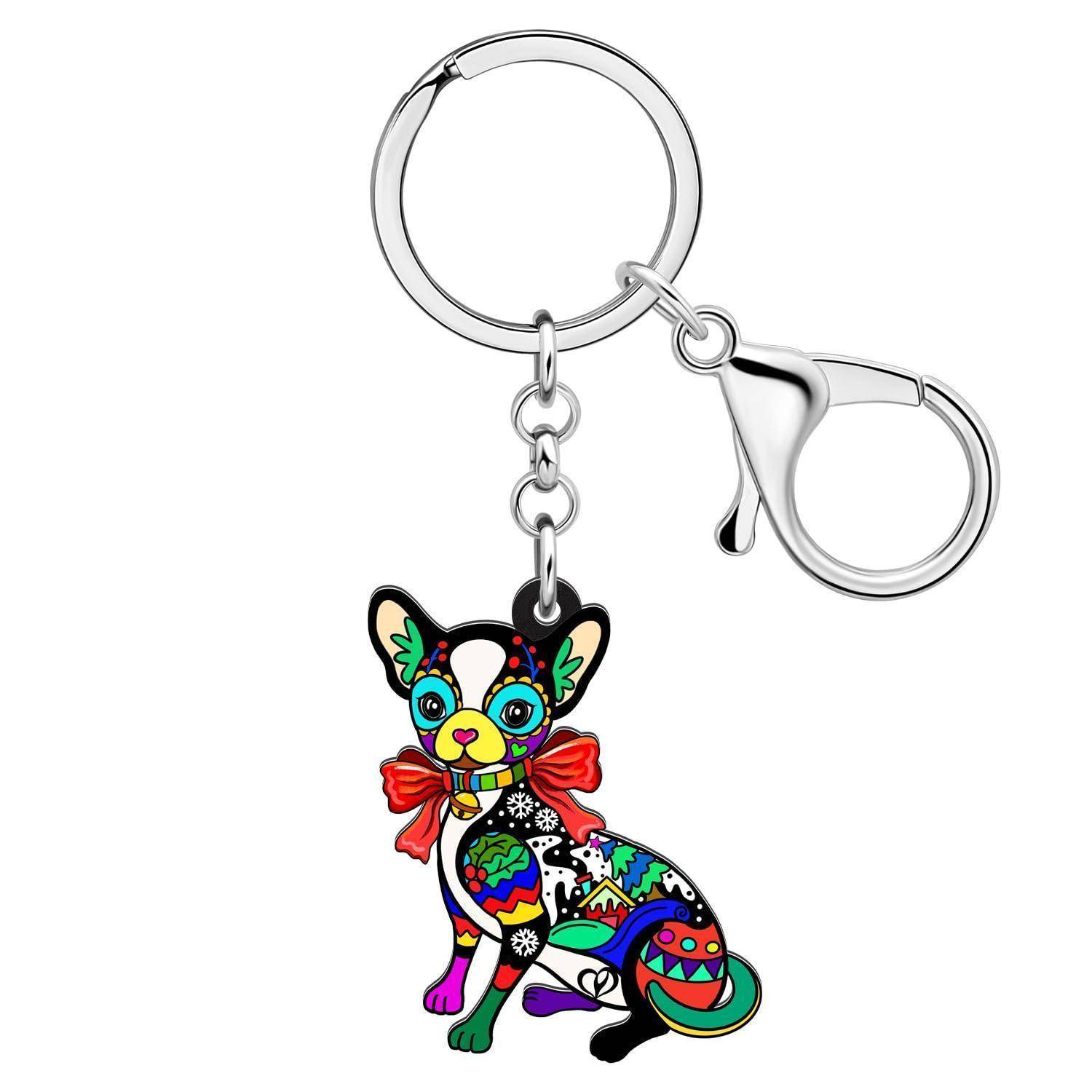 Bunter katzenförmiger Schlüsselanhänger mit silbernem Metallring und Hummerklaue, mit hellem dekorativem Katzenschmuck mit roter Schleife.