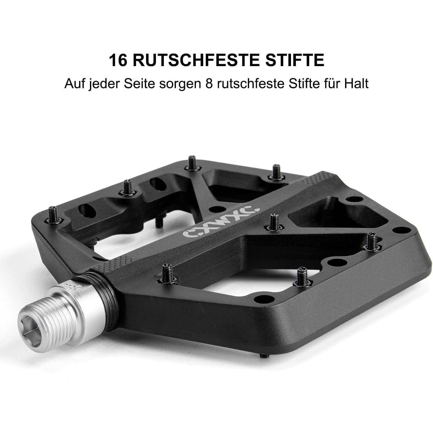 Schwarzes Plattformfahrradpedal mit Metallspindel und 16 rutschfesten Stiften; deutscher Text sagt „16 RUTSCHFESTE STIFTE" und „Auf jeder Seite sorgen 8 rutschfeste Stifte für Halt"".