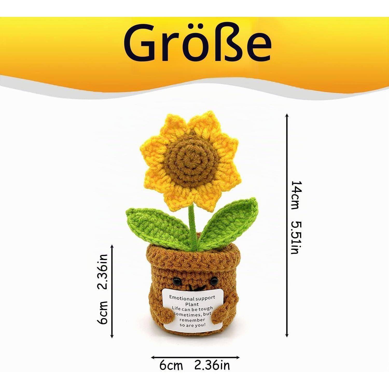 Gehäkelter Sonnenblume-im-Topf-Plüsch mit Größenangaben: 14 cm groß und 6 cm breit; kleines Etikett sagt „Emotionale Stützpflanze