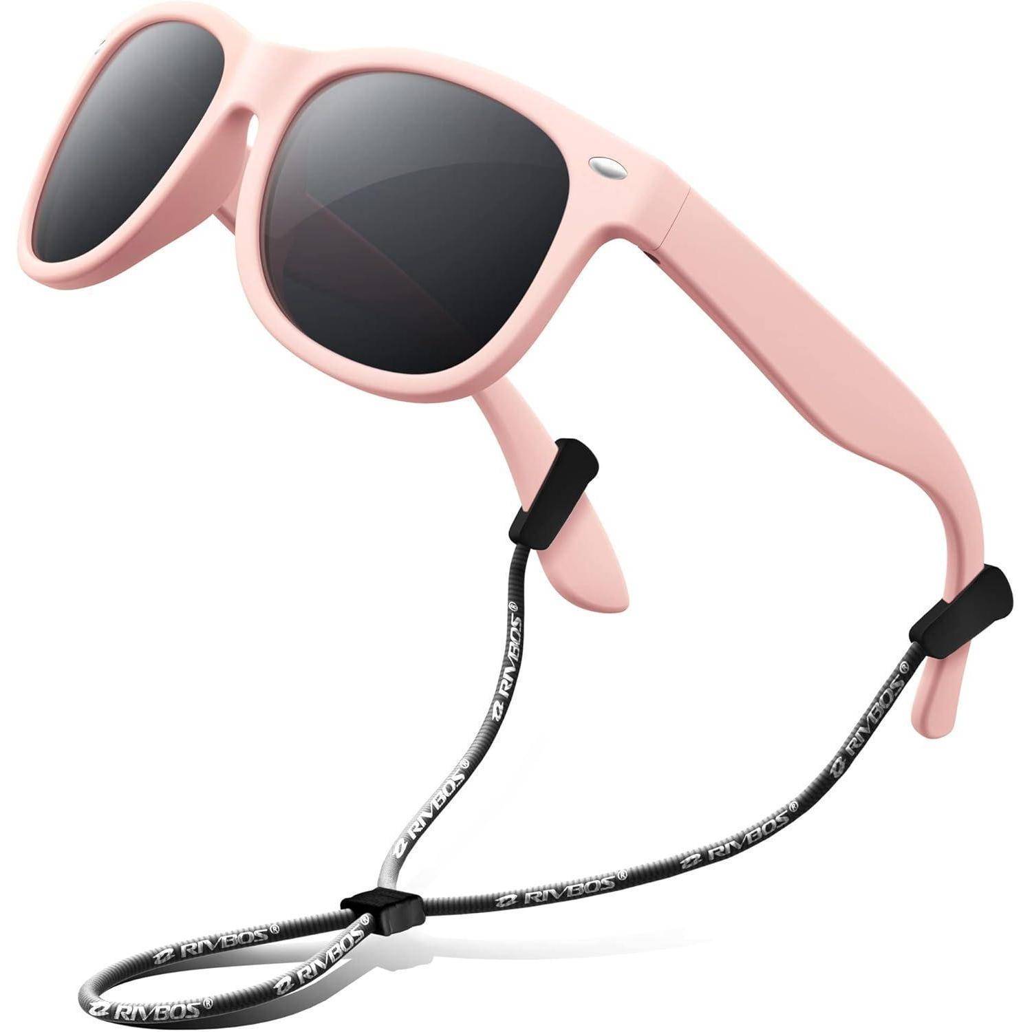 Rosa Wickelsonnenbrille mit schwarzen Gläsern und einem schwarzen Halteband, das darunter hängt.