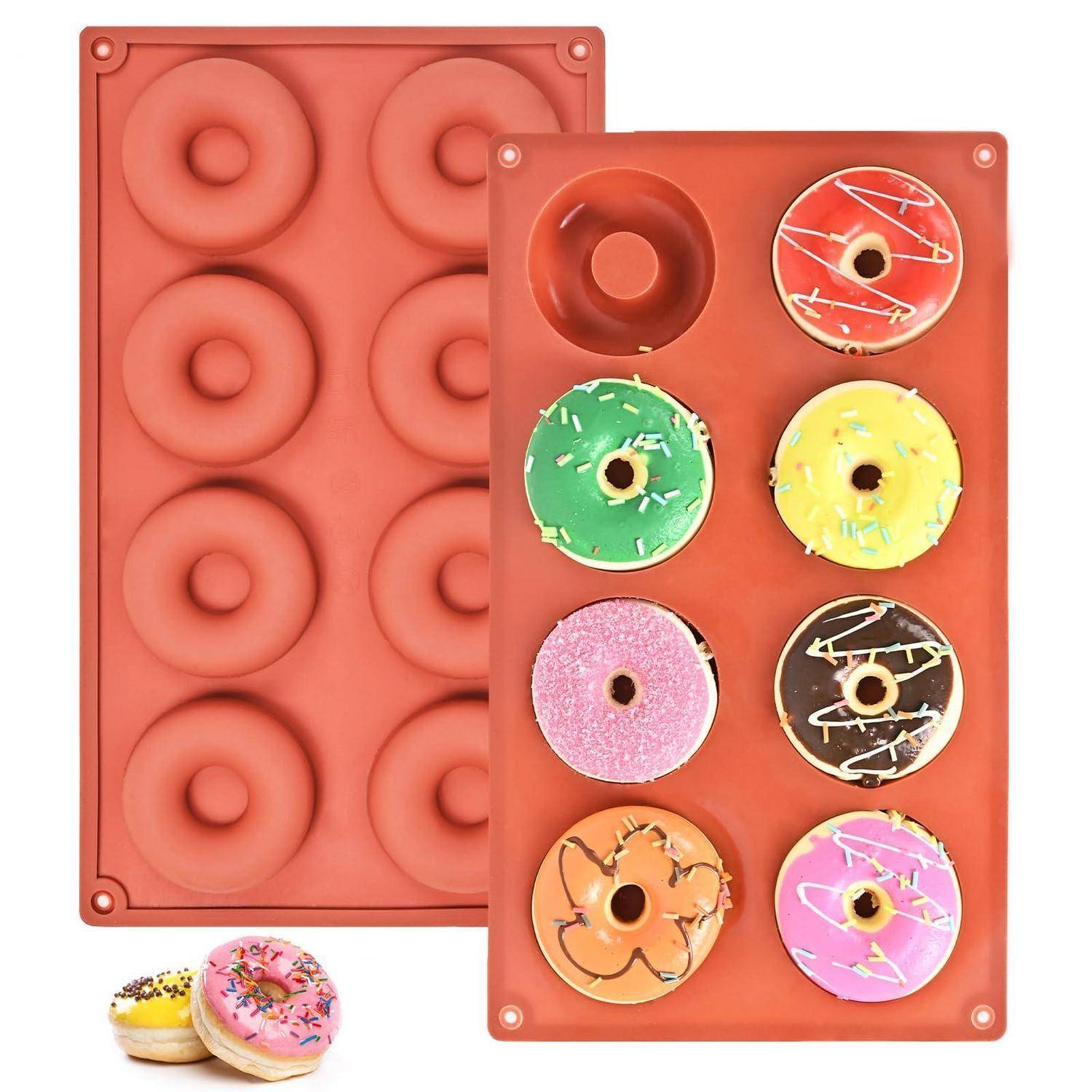 Zwei Silikon-Backformen, eine mit sechs Donut-Formen und eine mit sechs bunten Mini-Donuts in runden Vertiefungen.