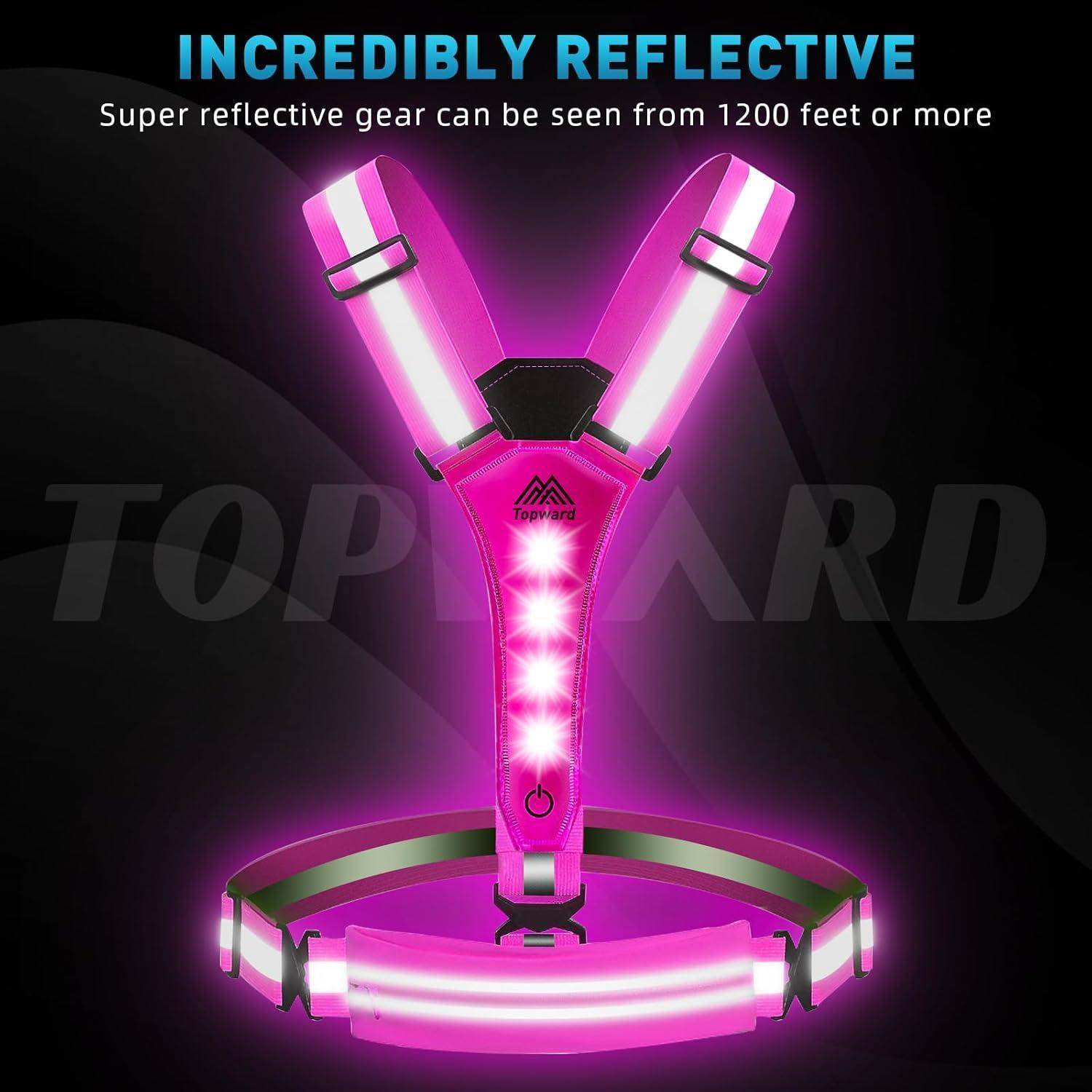 Anzeige für reflektierendes rosa LED-Sicherheitsausrüstung, die eine Weste und einen Gürtel mit leuchtenden Streifen zeigt; der Text besagt „Unglaublich reflektierend