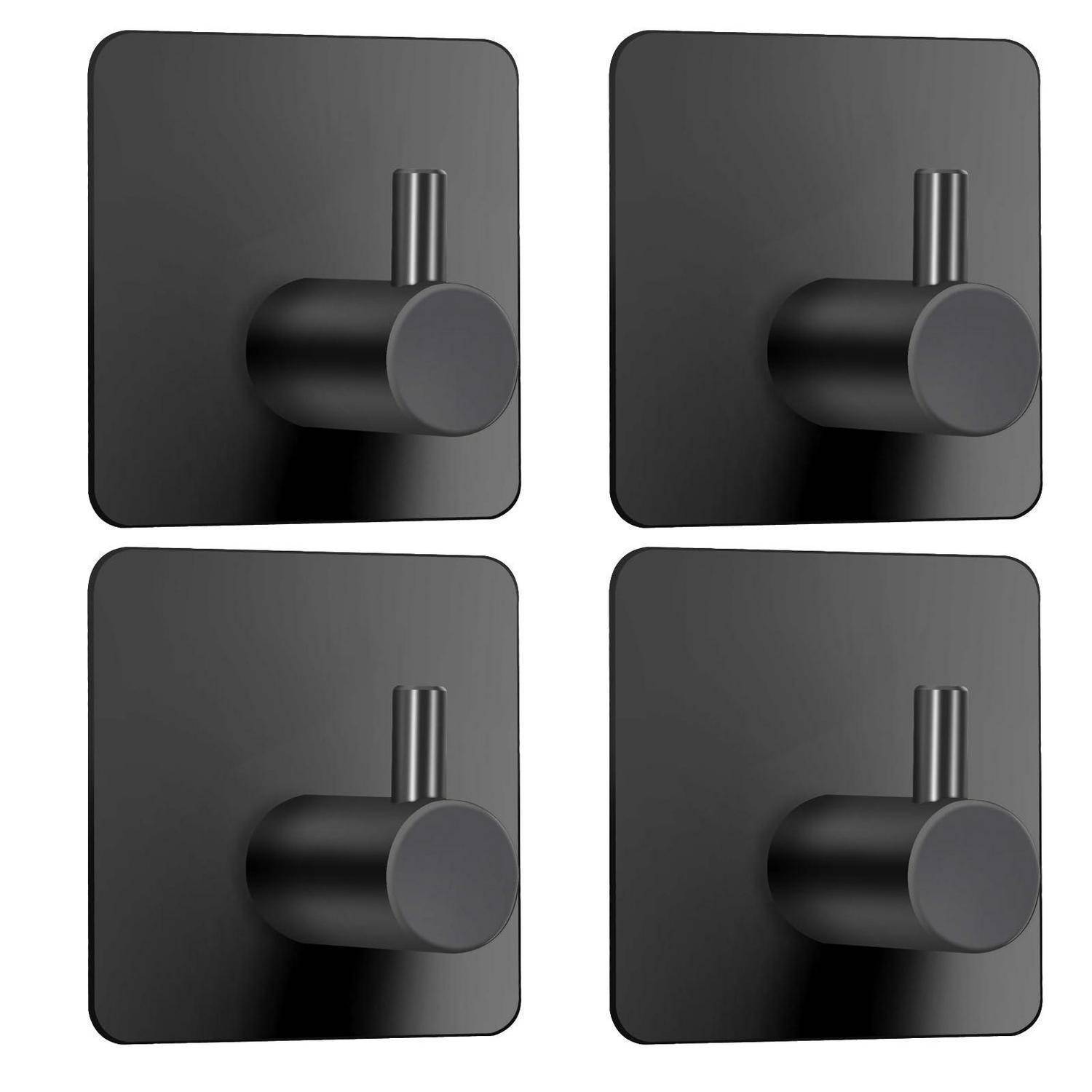 Vier schwarze quadratische Wandhaken mit zylindrischen Stiften in einem 2x2-Gitter angeordnet.
