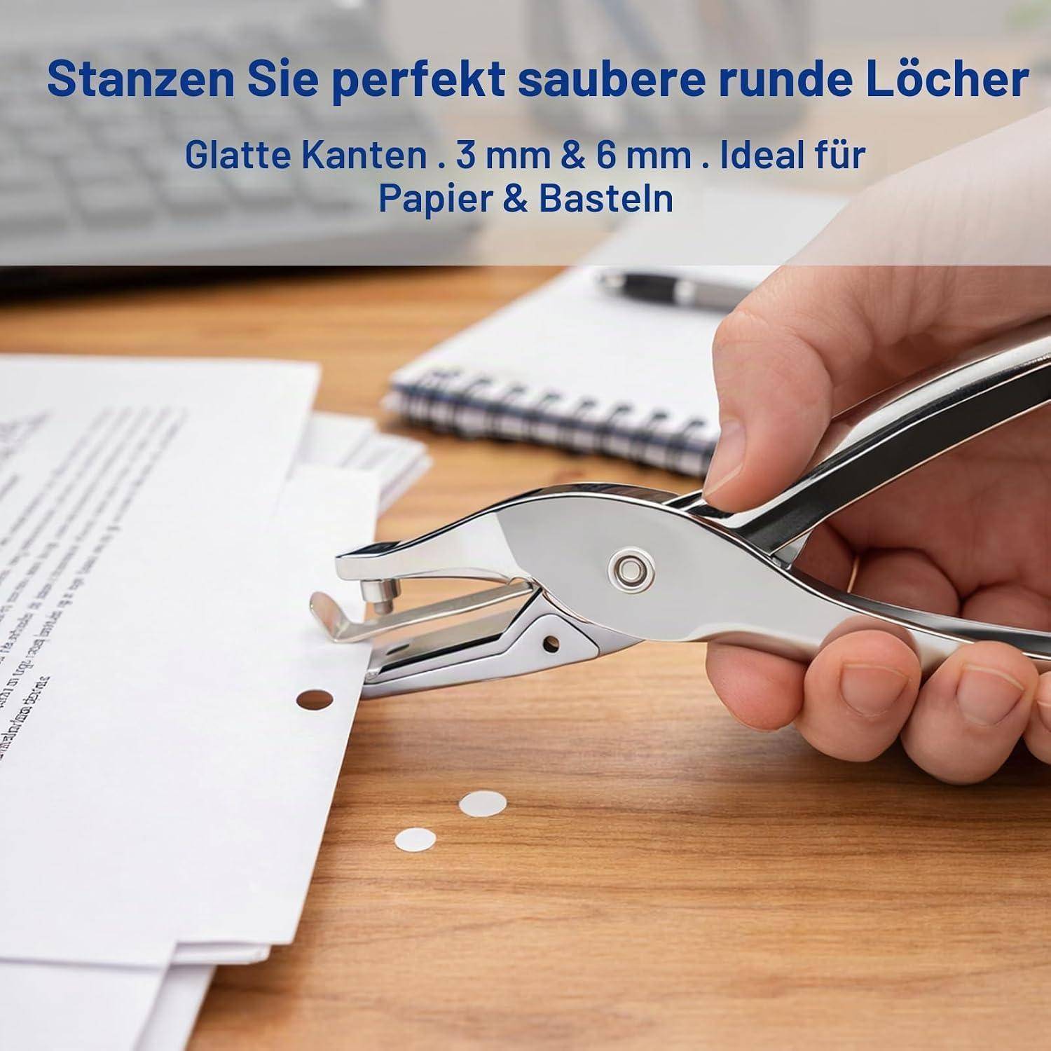 Hand mit einem Locher, um ein sauberes rundes Loch in Papier auf einem Schreibtisch zu machen; deutscher Text bewirbt 3-mm- und 6-mm-Löcher für Papier und Handwerk.