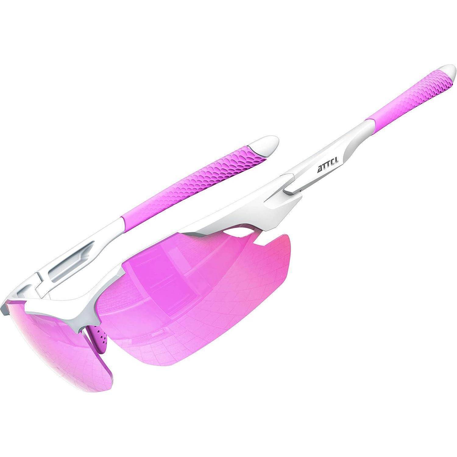 Rosa und weiße Sportsonnenbrille mit Umfassungsdesign, auswechselbaren getönten Gläsern und strukturierten Bügeln, gezeigt auf weißem Hintergrund.
