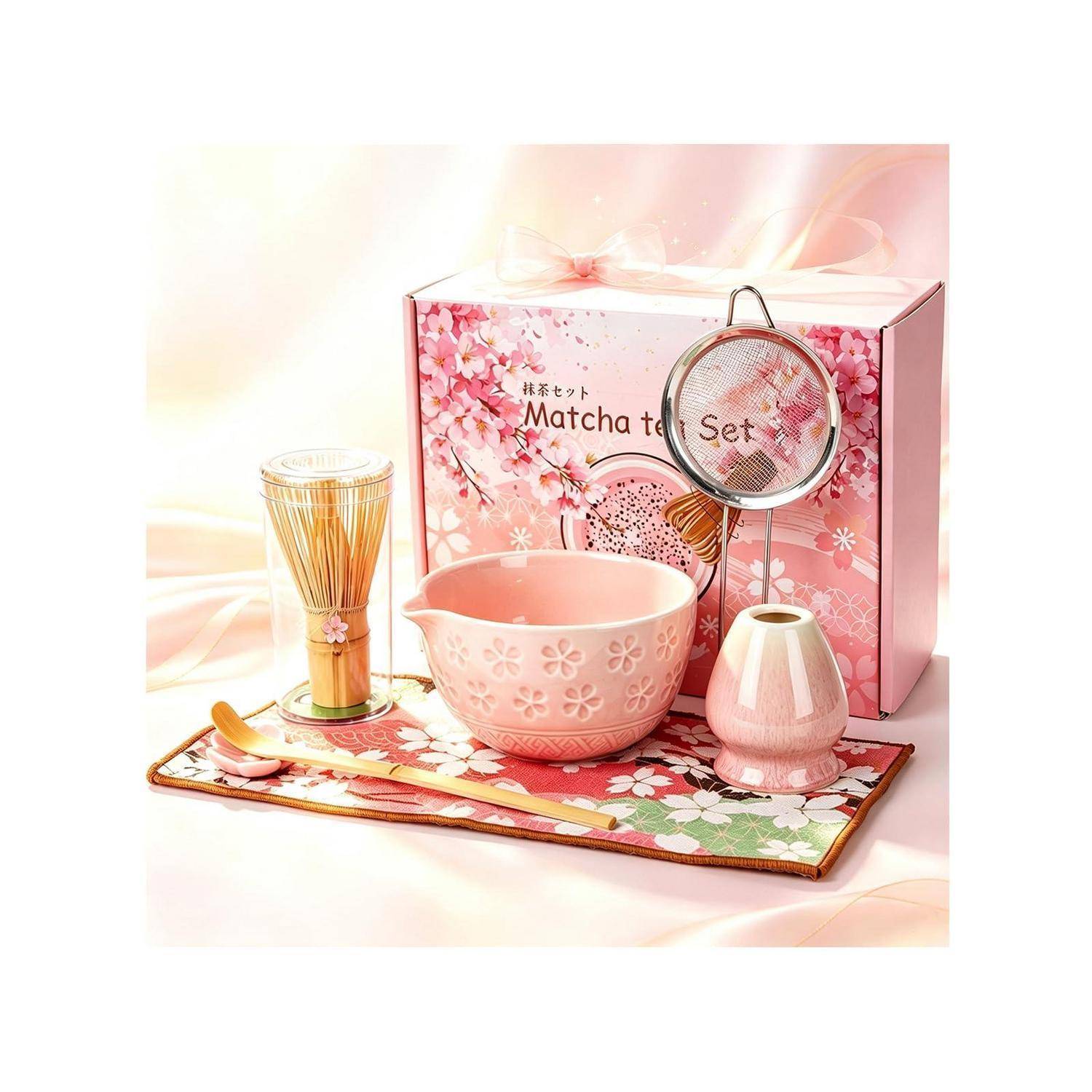 Rosa Matcha-Teeset mit Schale, Besen, Sieb und Besenständer auf einem Blumenmuster-Tablett präsentiert, verpackt in einer Kirschblüten-Box.