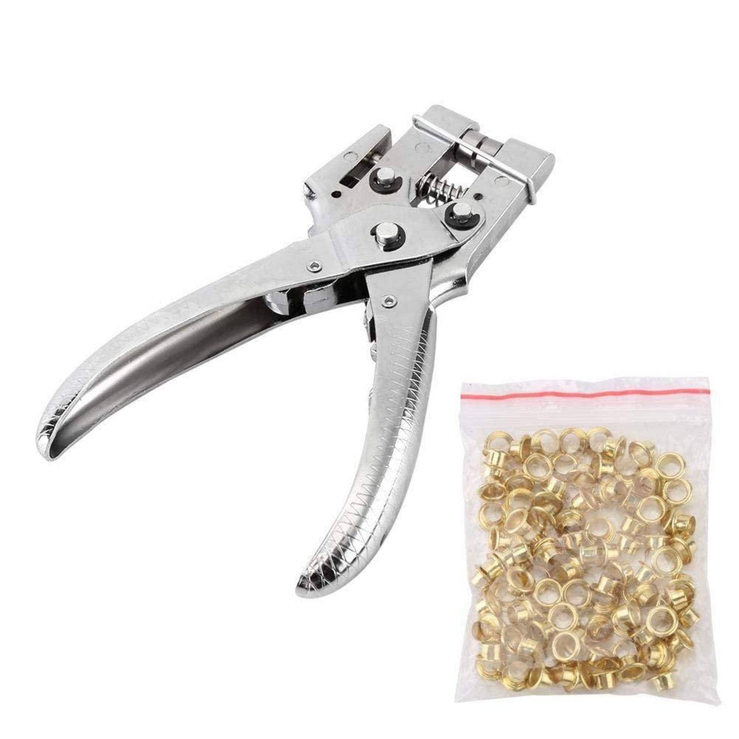 Handpresse aus Metall zum Setzen von Ösen oder Nieten, gezeigt mit einer Tüte messingfarbener Metallringe auf weißem Hintergrund.