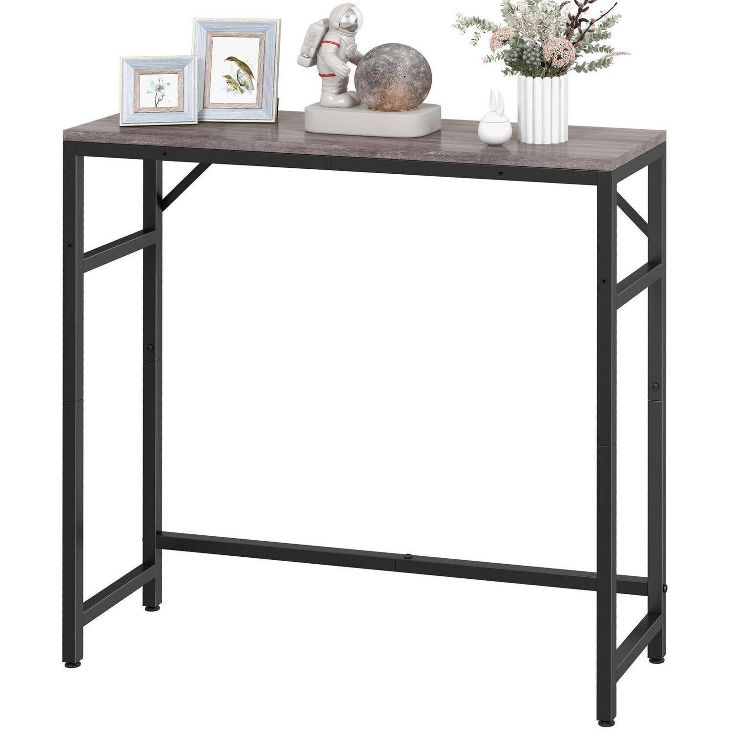 Moderner rechteckiger Konsolentisch mit dunkler Holzoptik-Platte und schwarzen Metallbeinen, gestylt mit Rahmenkunst, Skulptur, Vase und Blumen.