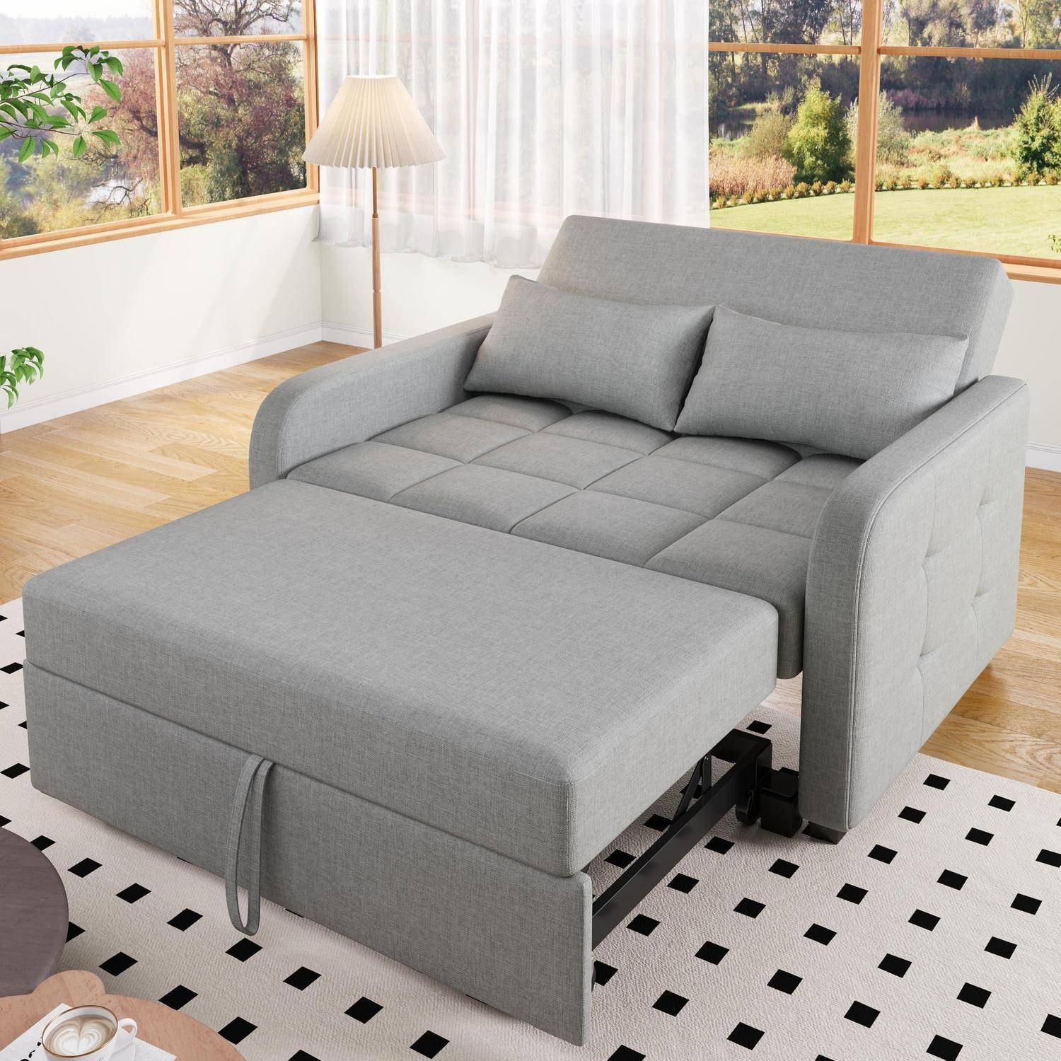 Graues Schlafsofa mit ausziehbarer Ottomane-ähnlicher Verlängerung in einem hellen Wohnzimmer, gezeigt als wandelbares Schlafsofa.