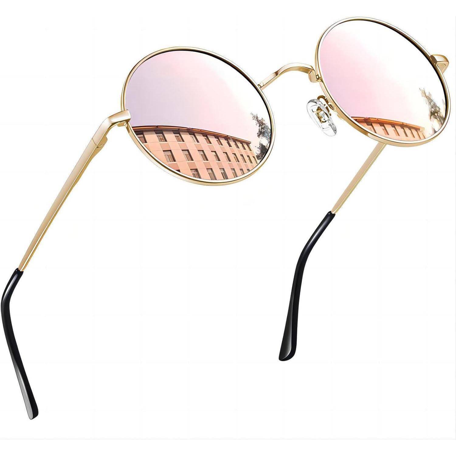 Runde Brille mit Goldrahmen, rosatönierten Gläsern und schwarzen Bügeln auf weißem Hintergrund.