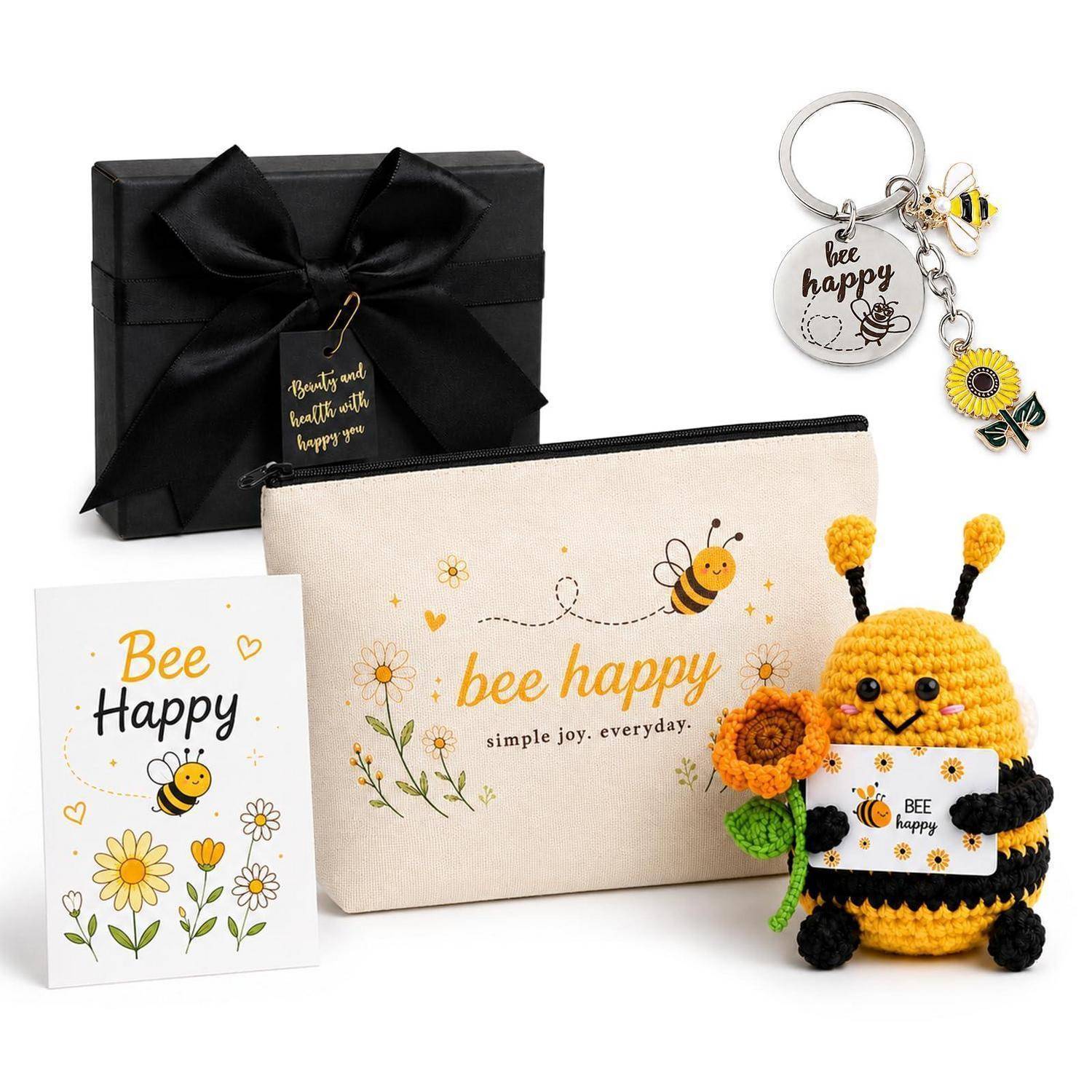Bee Happy Geschenkset mit schwarzer Geschenkbox, Karte, Reißverschlusstasche, Schlüsselanhänger und gehäkeltem Bienen-Plüsch, der eine „Bee Happy