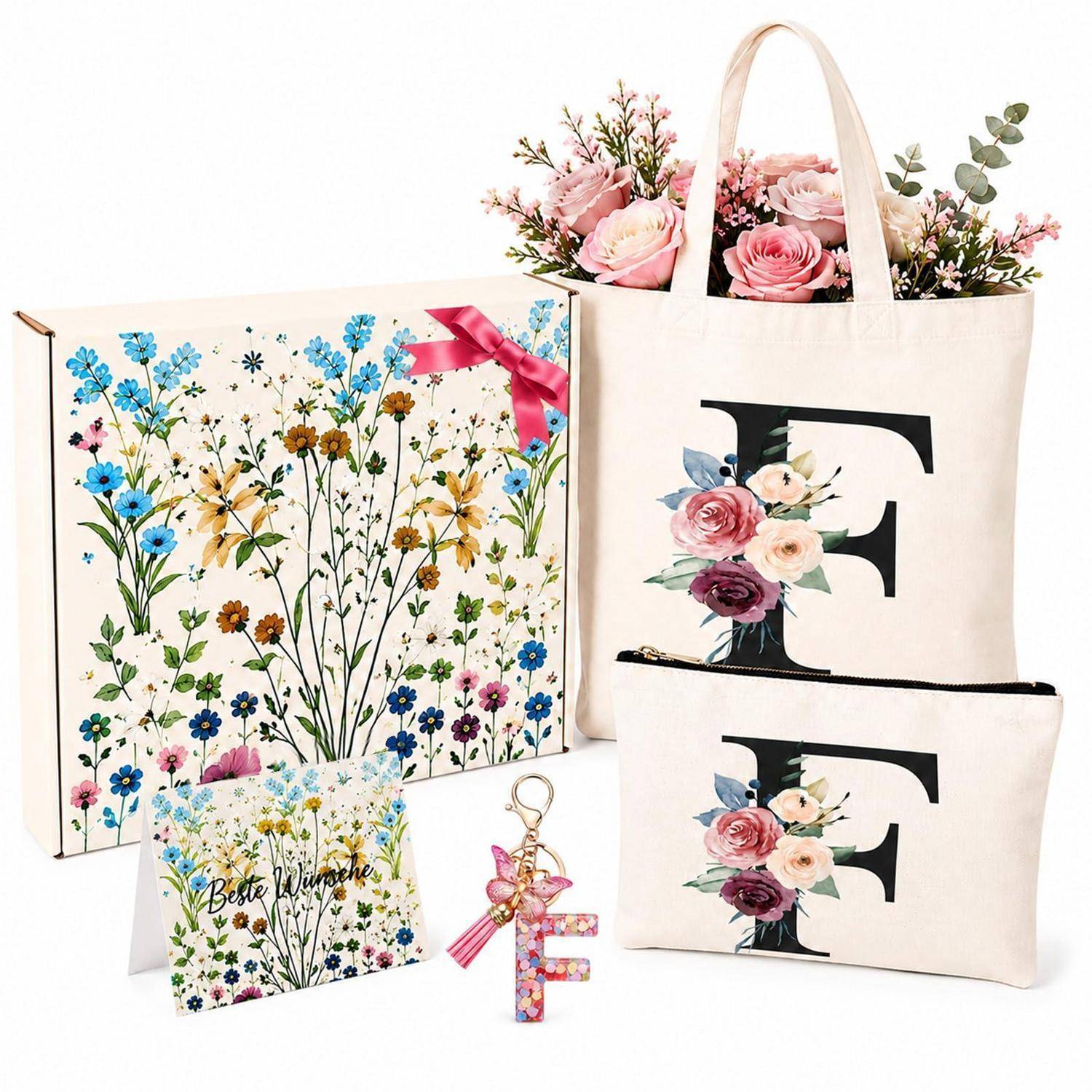 Florale Geschenkset mit zwei Einkaufstaschen mit 'F'-Monogramm, einem passenden Täschchen und Schlüsselanhänger, plus Box und Karte mit Blumenmuster.