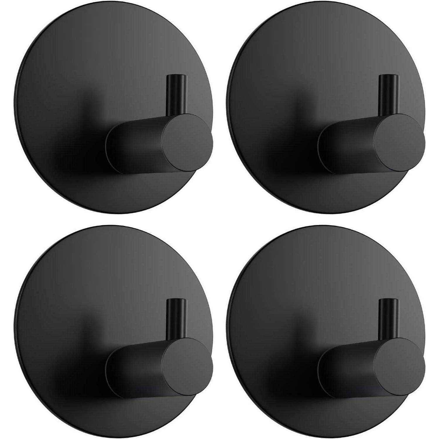 Vier schwarze kreisförmige Wandhalterungen mit kurzen zylindrischen Stiften, dargestellt als 2x2-Set auf weißem Hintergrund.