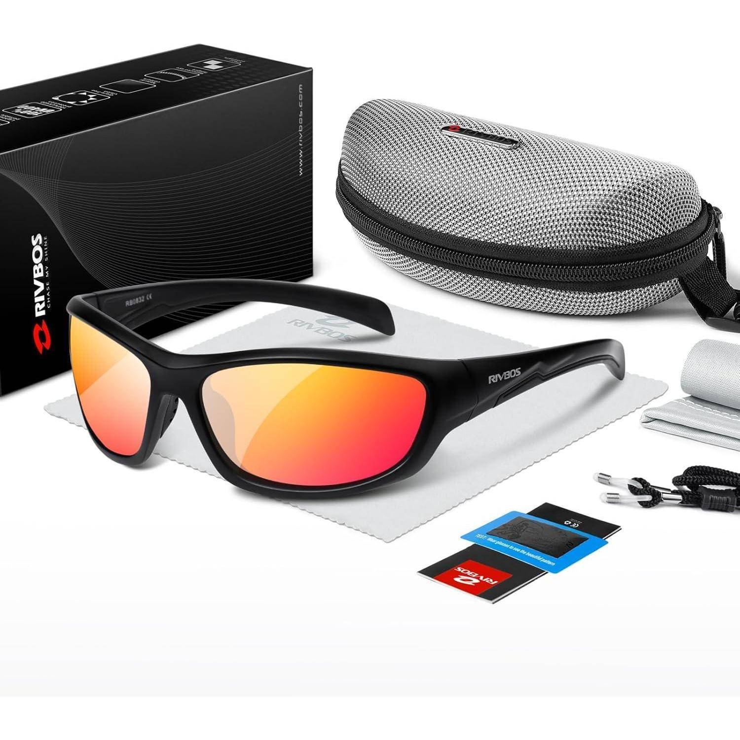 Schwarze Wickelsonnenbrille mit verspiegelten rot-orangefarbenen Gläsern, gezeigt mit Etui, Schachtel, Tuch, Riemen und zwei Linsenfilterkarten