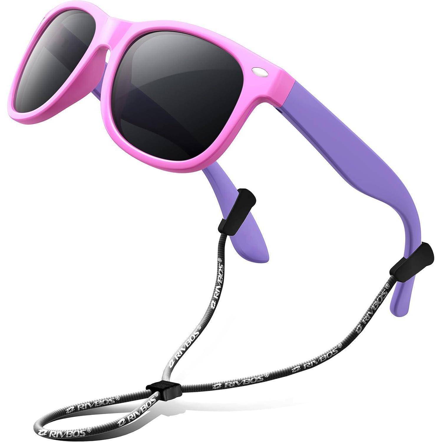Rosa und lila Kinder-Sonnenbrille mit schwarzen Gläsern und einem schwarz-weißen Band, das an den Bügeln befestigt ist.