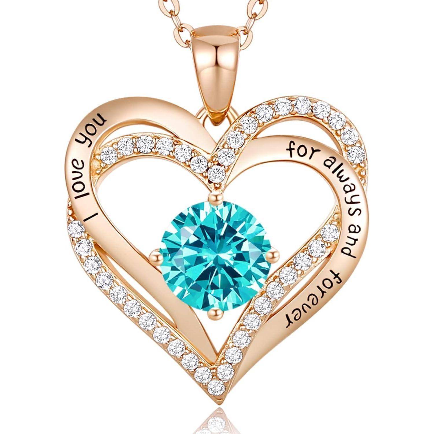 Herzförmiger goldener Anhängerkette mit blauem Edelstein in der Mitte und Diamanten, eingraviert 