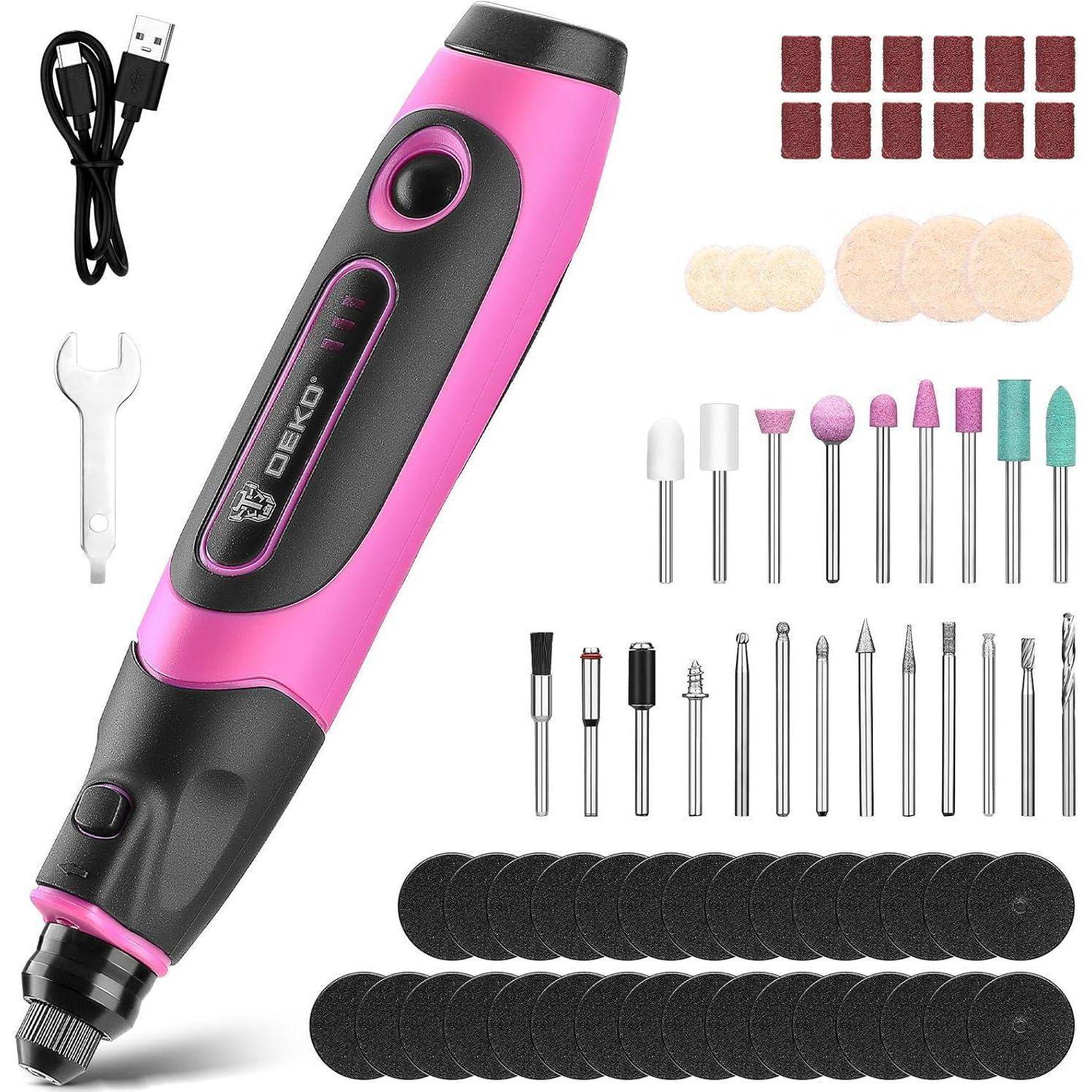 Rosa und schwarzes elektrisches Nagelbohrset mit USB-Kabel, Schraubenschlüssel, sortierte Schleifbänder, Polierscheiben und mehrere Bitaufsätze auf weißem Hintergrund.