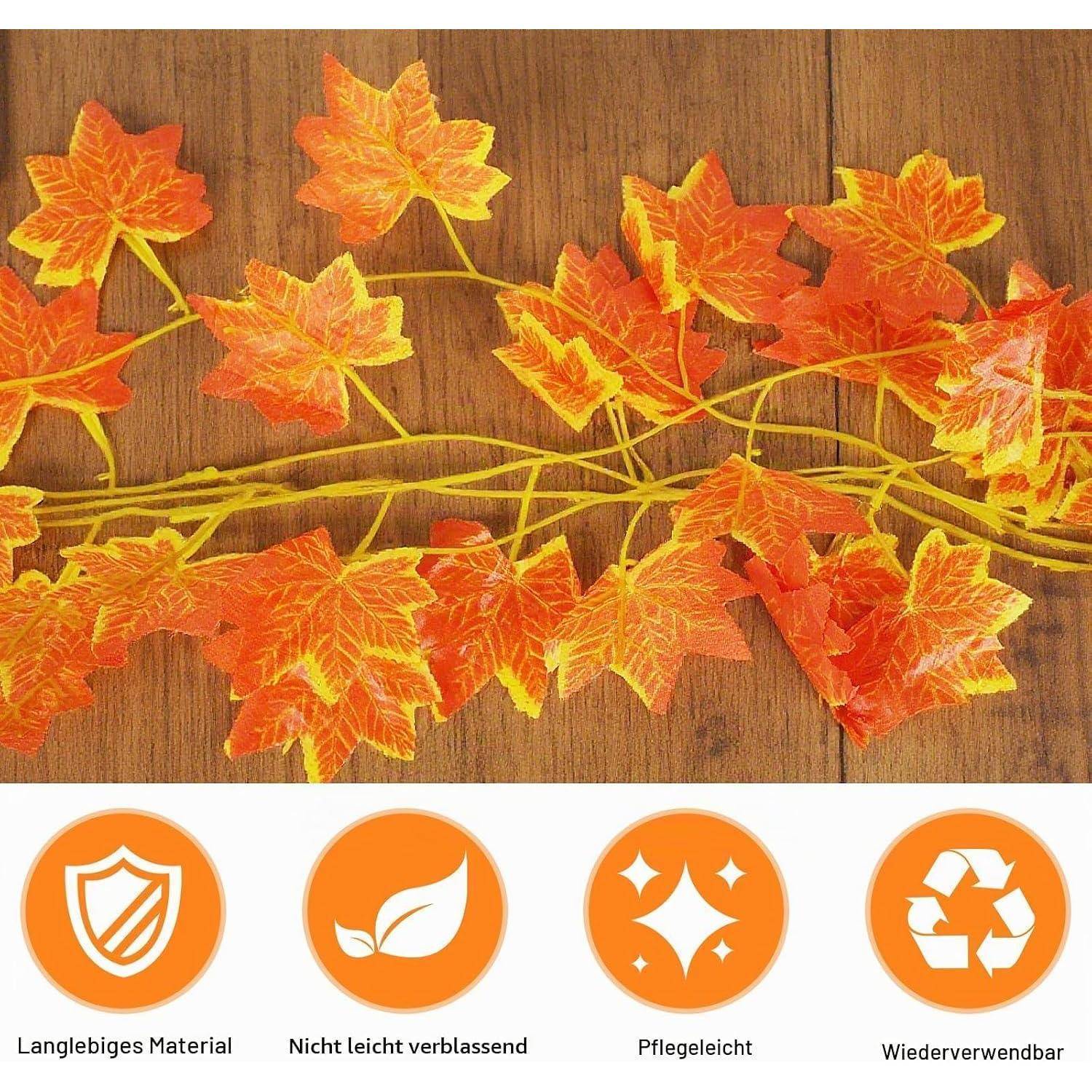 Künstliche Herbstahornblatt-Girlande auf einer Holzoberfläche, darunter vier orange Funktionssymbole: Schild, Blatt, Funkeln und Recycling-Symbol.