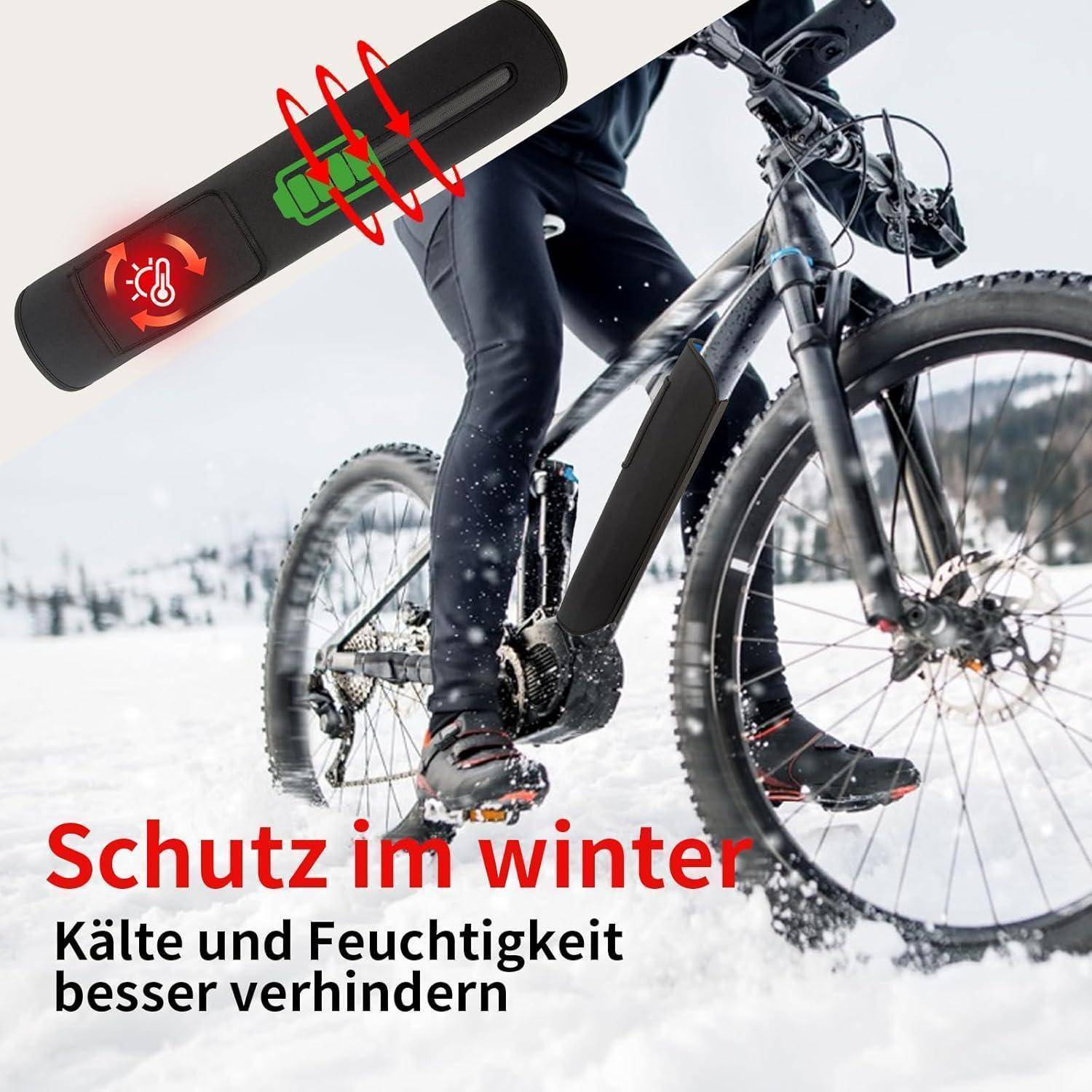 Winterfahrer auf Schnee mit einer Batteriepack-Illustration und deutschem Text „Schutz im Winter" und „Kälte und Feuchtigkeit besser verhindern"".