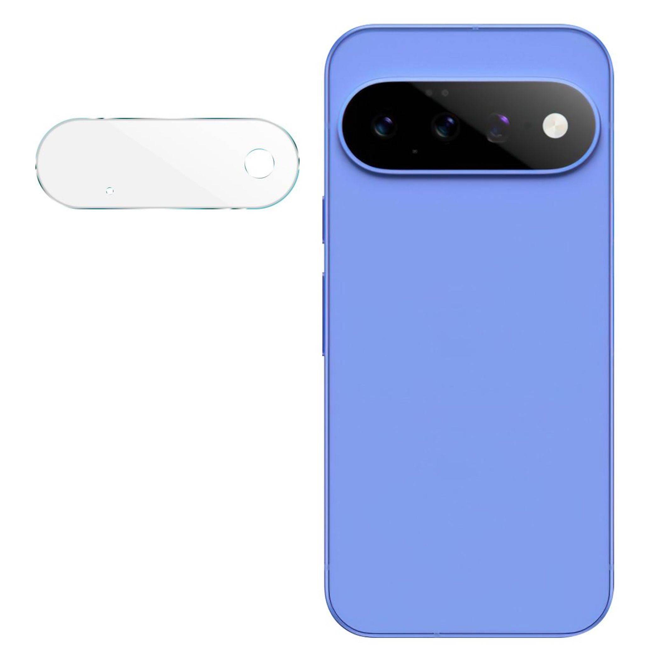 Blaue Smartphone-Rückseite mit schwarzer horizontaler Kameraleiste; separates weißes ovales Zubehör oder Schutzhülle links auf einfachem Hintergrund dargestellt.