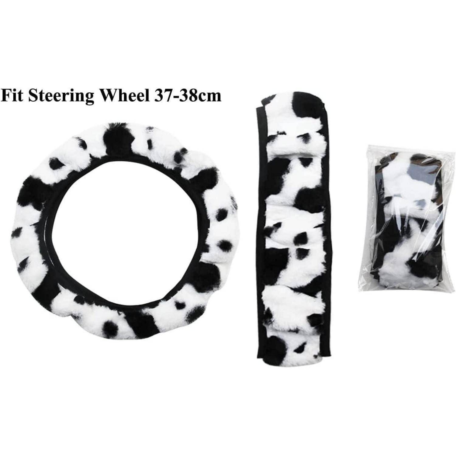 Schwarz-Weiß Kuh-Muster Lenkradschutz-Set für 37-38 cm Räder, gezeigt mit dem Lenkradschutz, passendem Schaltknauf-Überzug und verpacktem Zubehör.