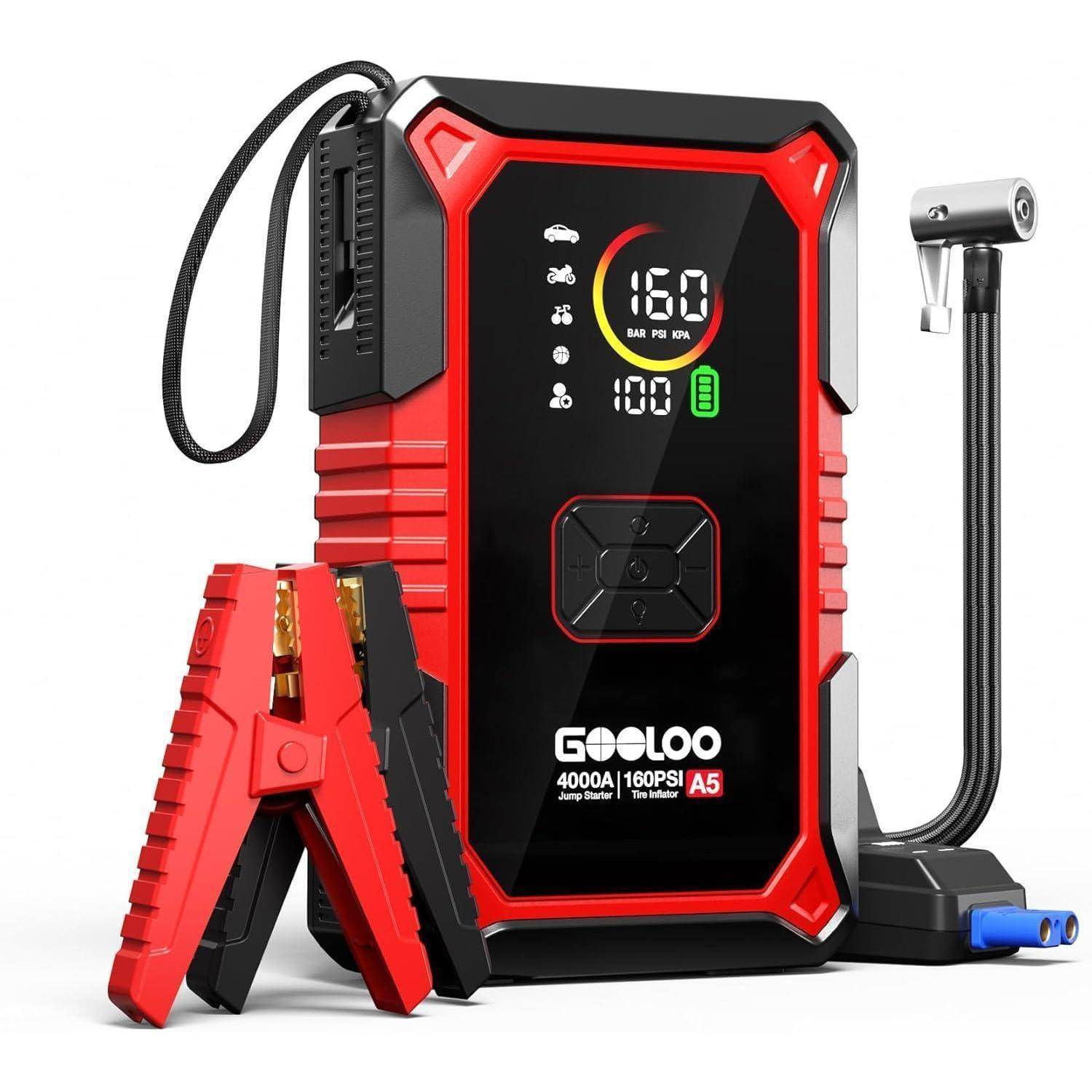 Tragbarer Starthilfegerät in Rot und Schwarz mit digitaler Druckanzeige, Starthilfeklemmen und angebrachtem Luftschlauch/Pumpendüse, dargestellt mit Zubehörklemmen und Trageband.
