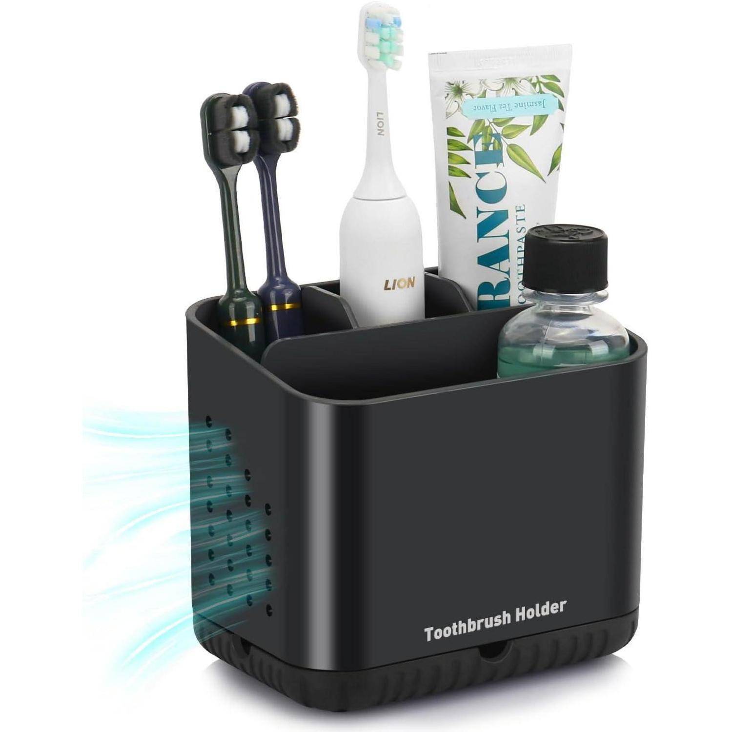 Schwarzer Zahnbürstenhalter mit zwei elektrischen Zahnbürsten, einer Zahnpastatube und einer Mundwasserflasche; Lüftungsöffnungen an der Seite.