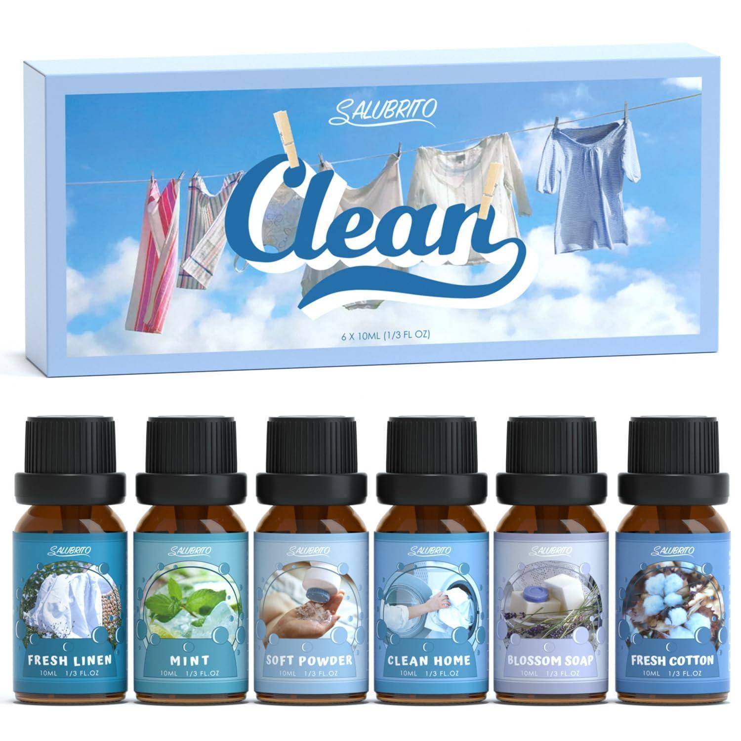 Produktbild von Salubrito 'Clear' Wäscheduftboostern, das eine Schachtel und sechs kleine Duftflaschen zeigt, die mit Fresh Linen, Mint, Soft Powder, Clean Home, Blossom Soap und Fresh Cotton gekennzeichnet sind.