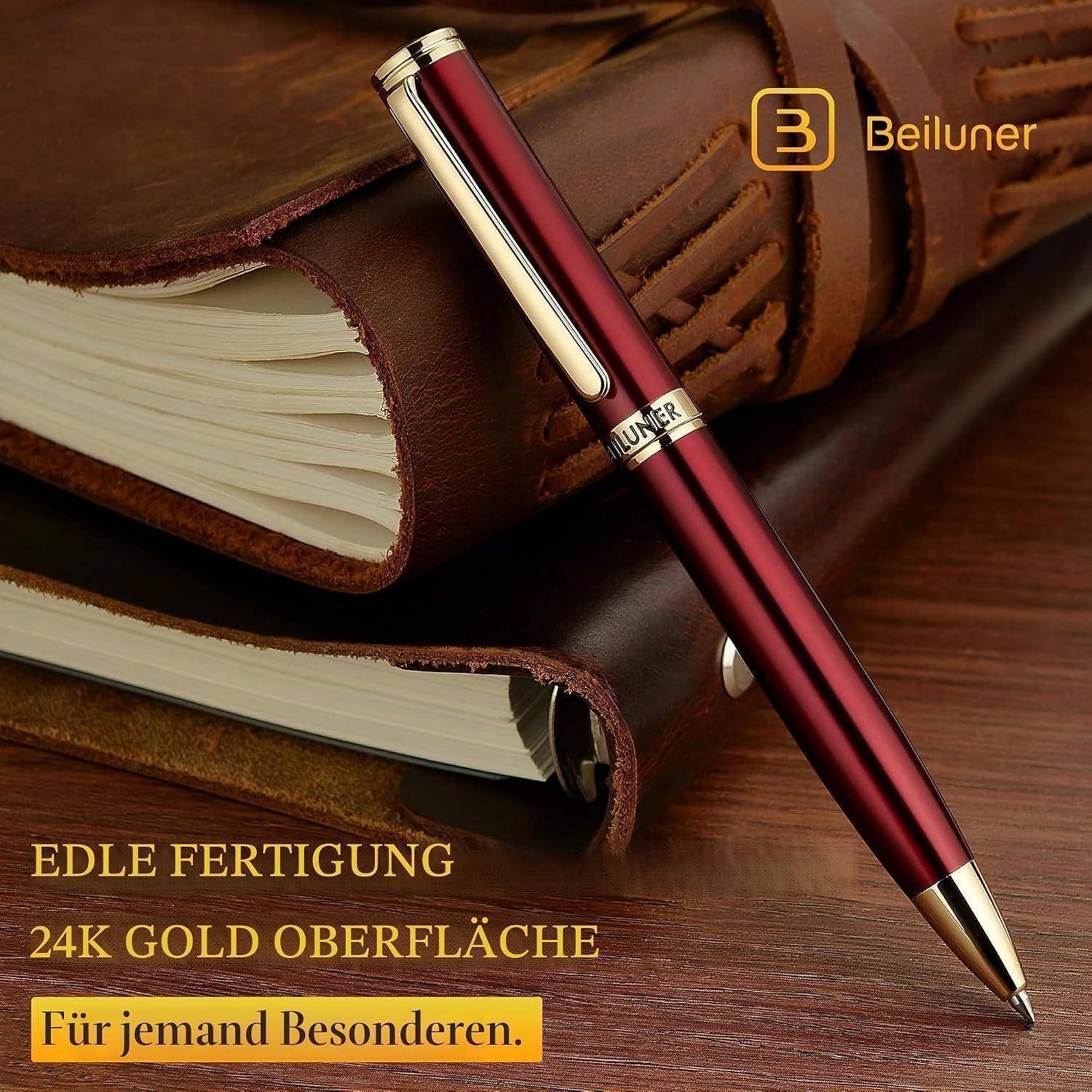 Roter metallischer Beiluner Stift auf ledergepundenem Buch, mit deutschem Text für handgefertigte 24-Karat-Goldoberfläche für jemanden Besonderen.