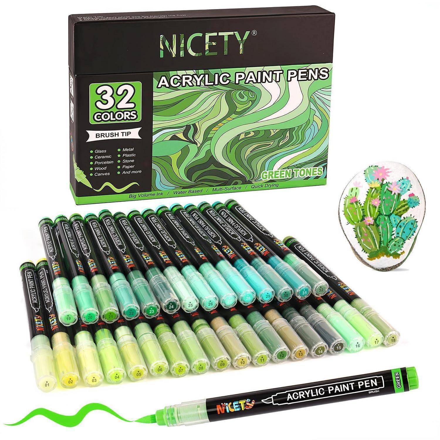 Set von NICETY 32-Farb-Acrylmalstiften mit Pinselspitzen, gezeigt mit Schachtel, angeordnete Stifte in Grüntönen und ein bemaltes Kaktus-Designmuster.