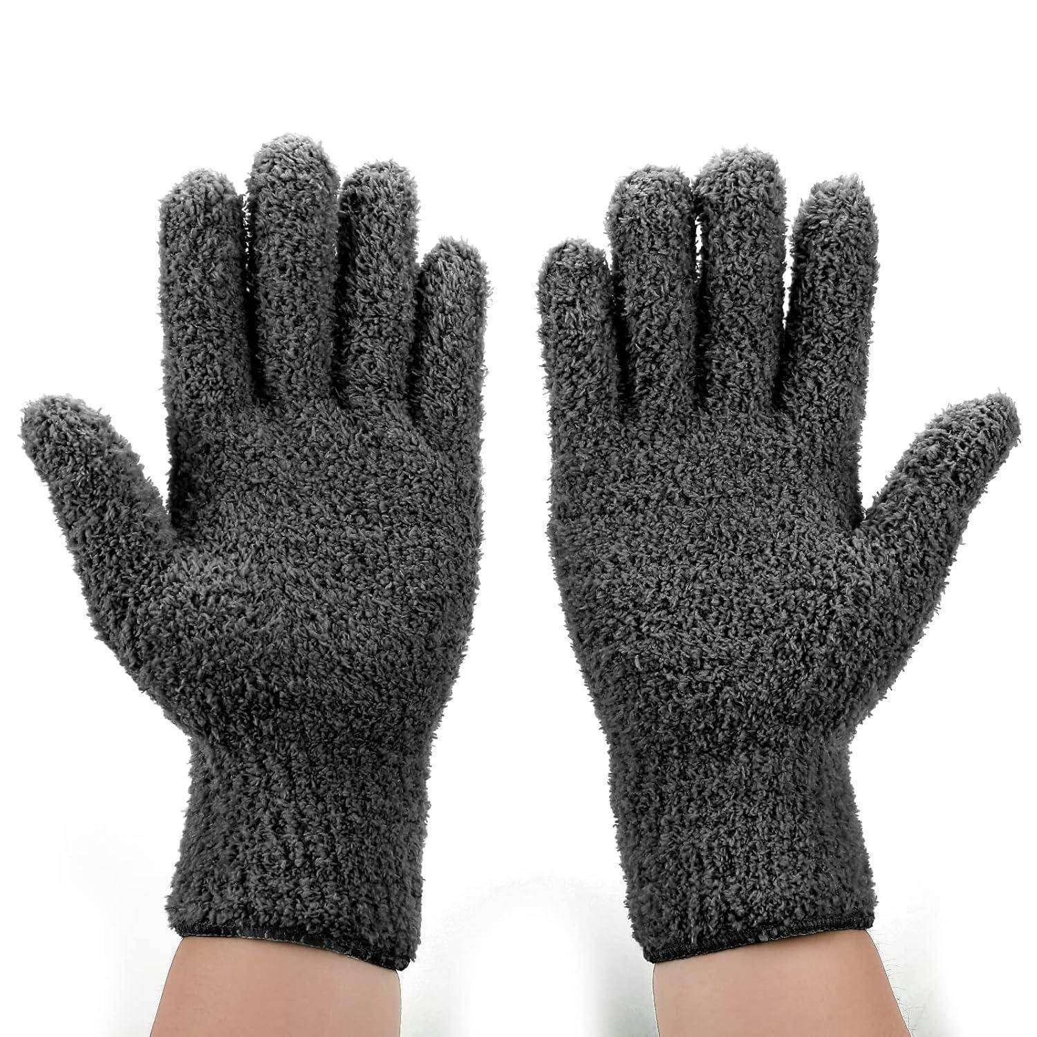 Ein Paar dunkelgrauer strukturierter Handschuhe, die mit den Handflächen nach vorne auf weißem Hintergrund gezeigt werden.