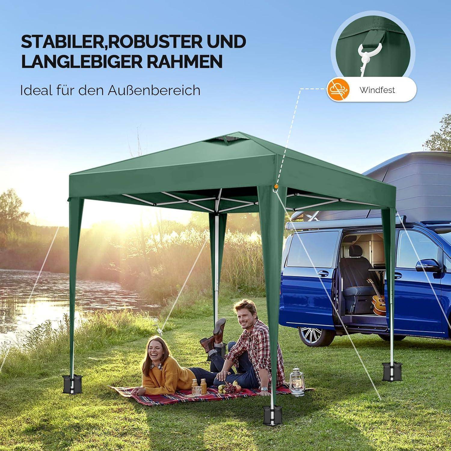 Outdoor-Grünzeltdach mit verstärktem Rahmen, gezeigt mit einem Paar, das neben einem blauen Lieferwagen picknickt; der deutsche Text sagt „STABILER, ROBUSTER UND LANGLEBIGER RAHMEN" und „Ideal für den Außenbereich"", mit der Bezeichnung „Windfest"".