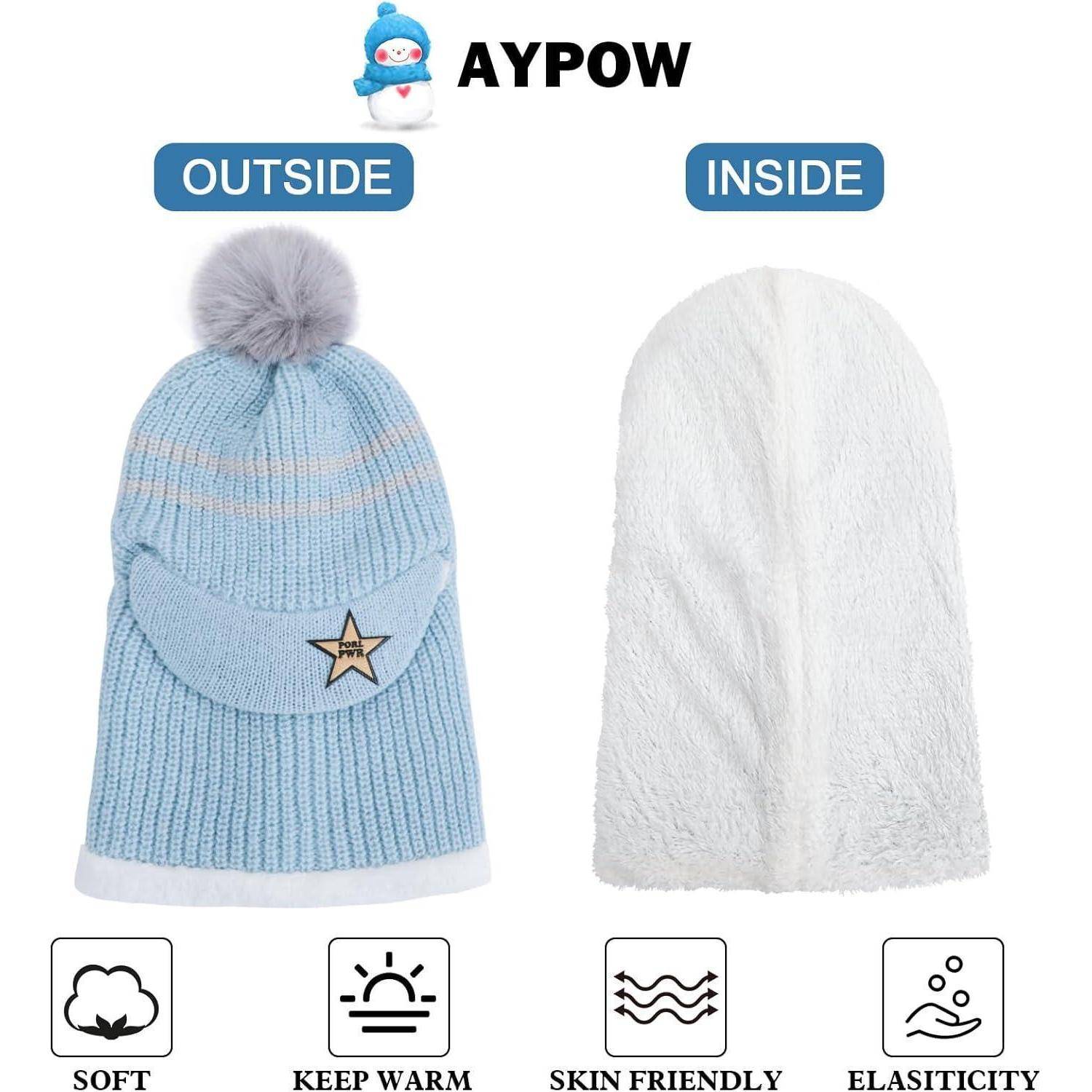 Eine blaue gestrickte Wintermütze mit Bommel wird außen und innen gezeigt, mit Symbolen für weiches, warmes, hautfreundliches, elastisches Material darunter.