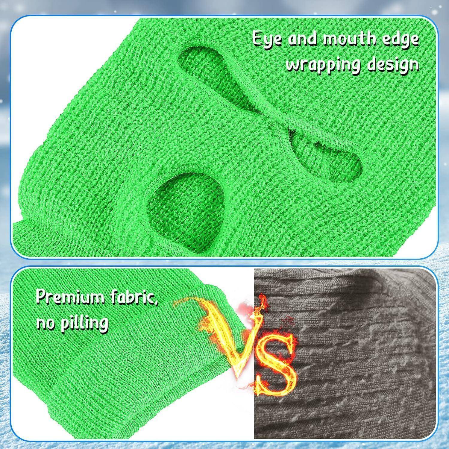 Grüne gestrickte Gesichtsmaske Balaclava mit Augen- und Mundöffnungen; die Einfügung vergleicht „Premium-Stoff, kein Pilling" gegen einen grauen Stoff mit „VS"".