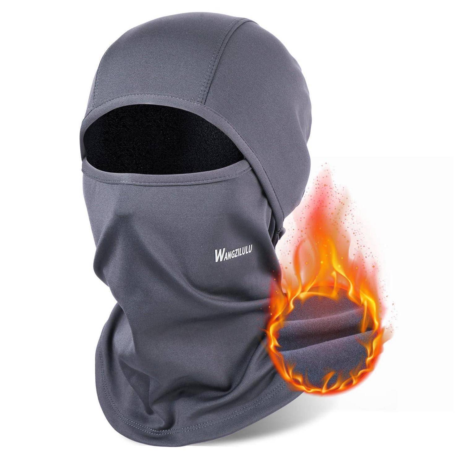 Graue Wärme-Sturmhaube mit Gesichtsmaske und Augenöffnung, dargestellt mit einer Flammen-Grafik, die Feuereschutz und Wärmeschutz andeutet.