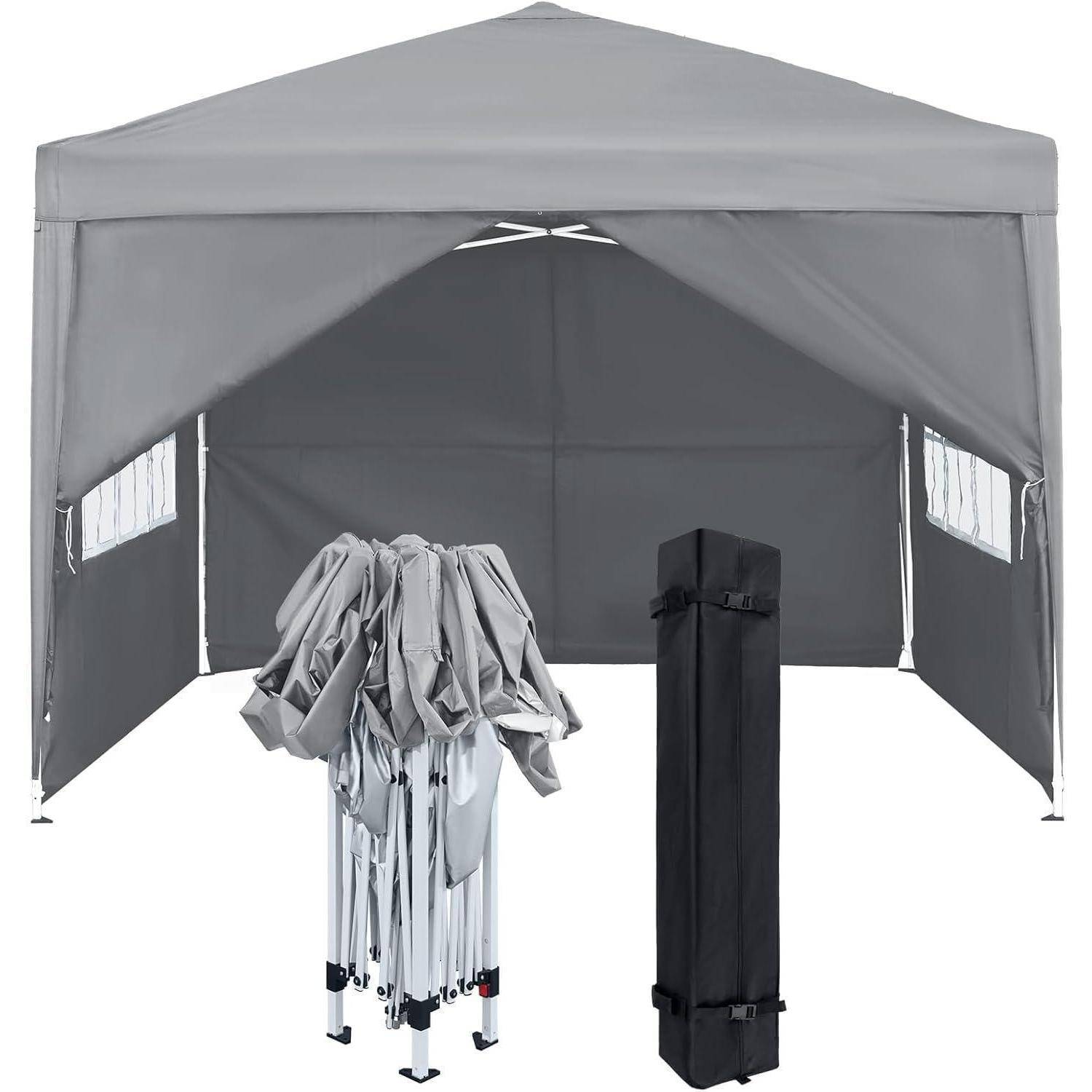 Grauer Pop-up-Pavillon mit Seitenwänden, dargestellt offen und mit zwei zusammengelegten Tragetaschen vorne.