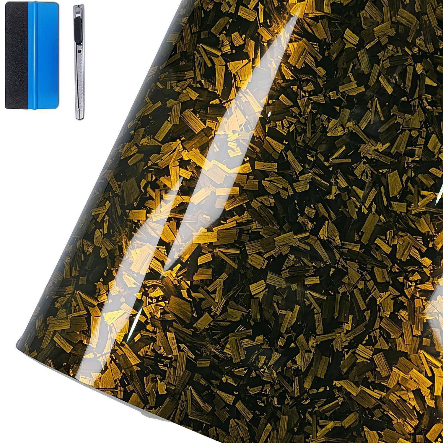 Glänzende Rolle aus schwarzem und goldenem Konfetti-Stil-Klebeband, mit einer kleinen gefalteten Musterprobe zur Größenangabe