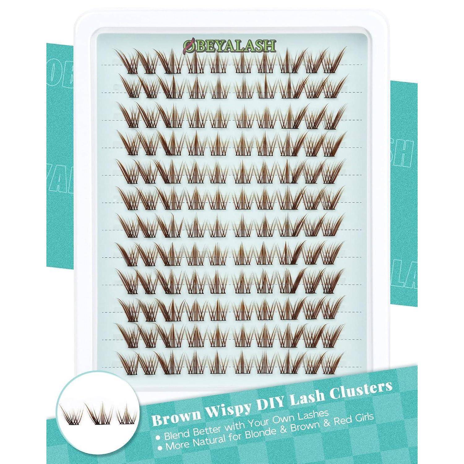 Produktbild von 'OBEYALASH' braune, hauchzarte DIY-Wimperncluster, die in Reihen auf einer Displaykarte angeordnet sind, mit einem Etikett, das 'Brown Wispy DIY Lash Clusters' liest.