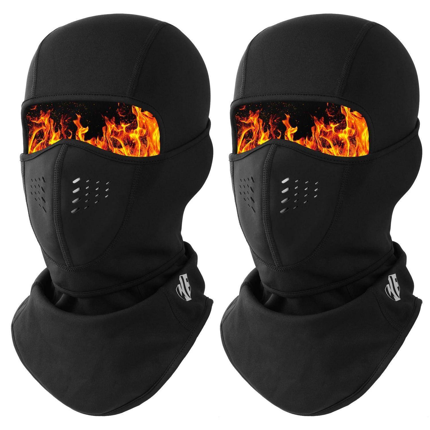 Zwei schwarze Sturmhaube-ähnliche Gesichtsmasken mit flammenmusterförmigen Augenlöchern, nebeneinander auf weißem Hintergrund abgebildet.
