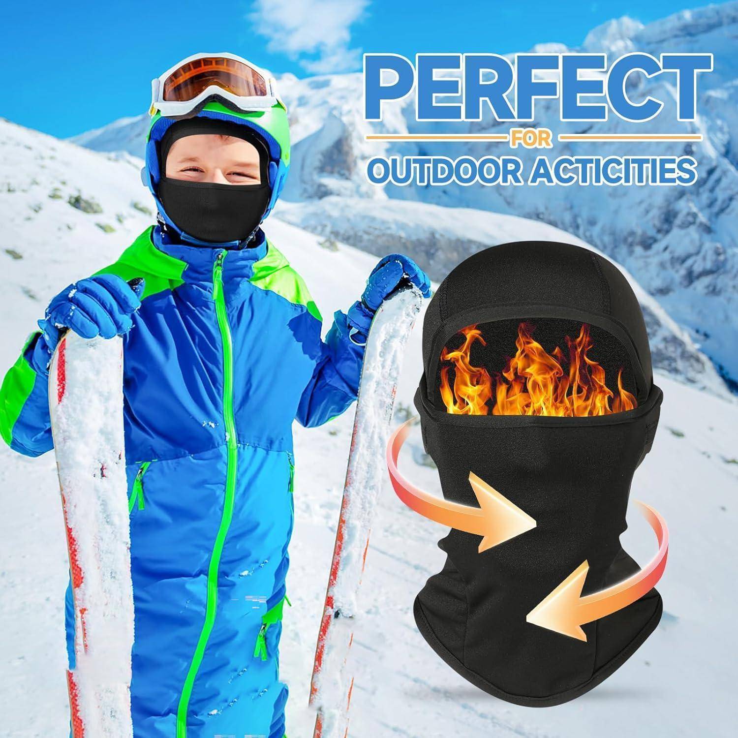 Kind in Skiausrüstung auf verschneitem Berg neben einer beheizten schwarzen Sturmhaube; Text lautet „PERFEKT FÜR OUTDOOR-AKTIVITÄTEN