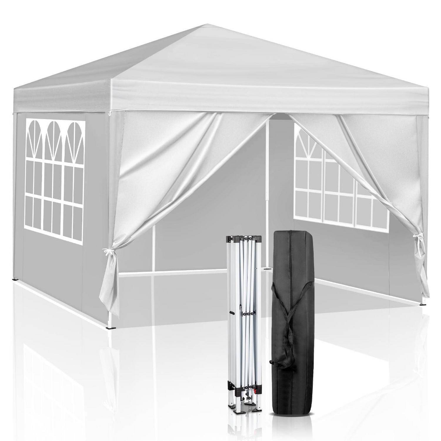 Grauer Pop-up-Pavillon mit drapierten Eingangsflügeln und verglasten Seitenwänden, abgebildet mit zusammengeklapptem Gestell und Transporttasche davor.