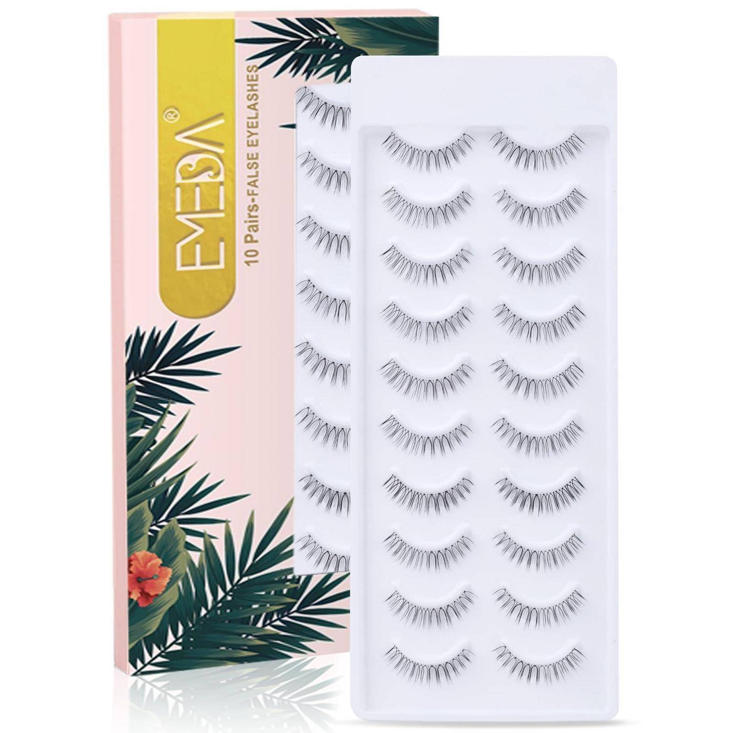 Packung mit EMESI 10 Paar falscher Wimpern in einer rosa tropischen Schachtel neben einem Tablett mit einzelnen Wimpernstreifen.